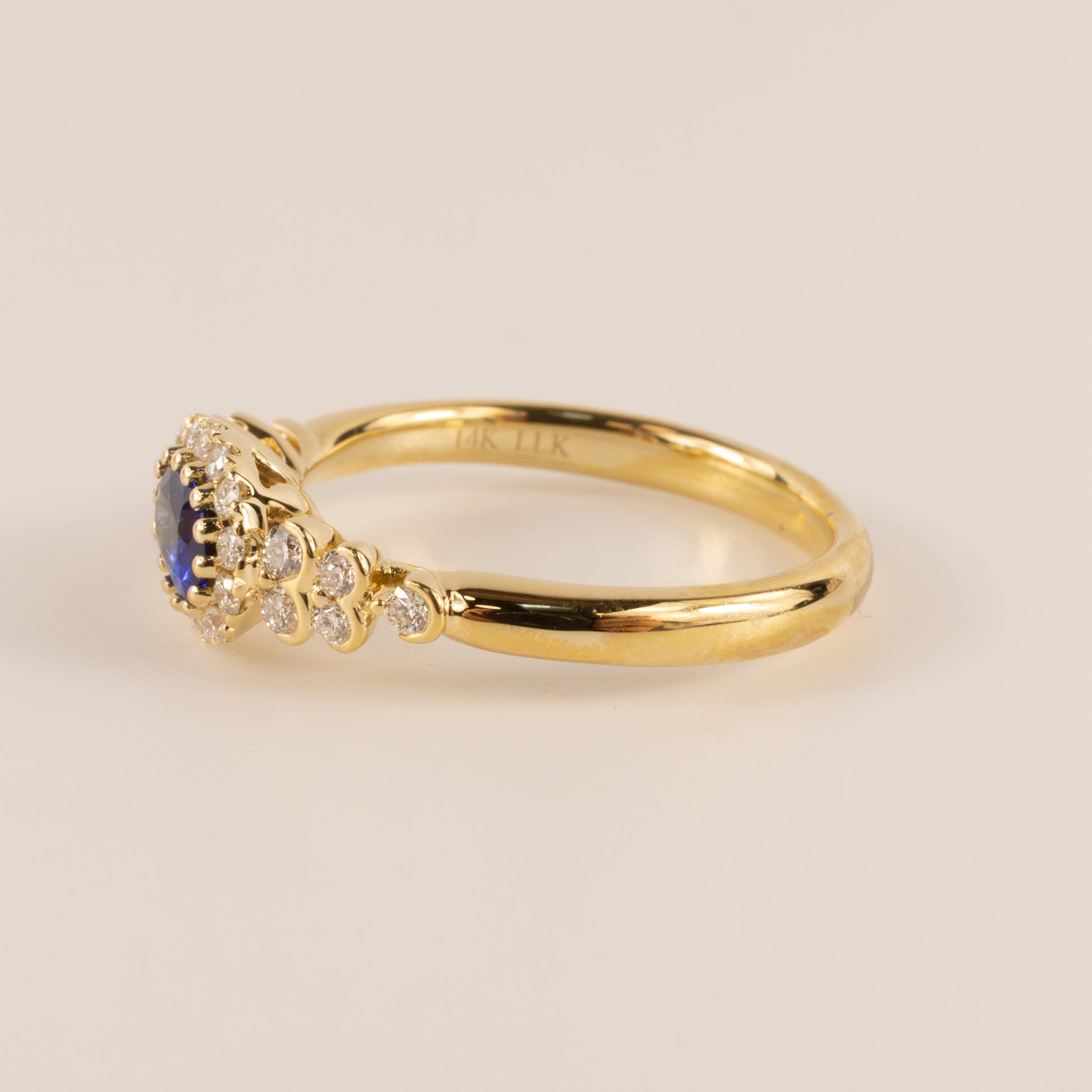 14KYG Sapphire Oval and Diamond Halo and Semi Bezel Accented Ring