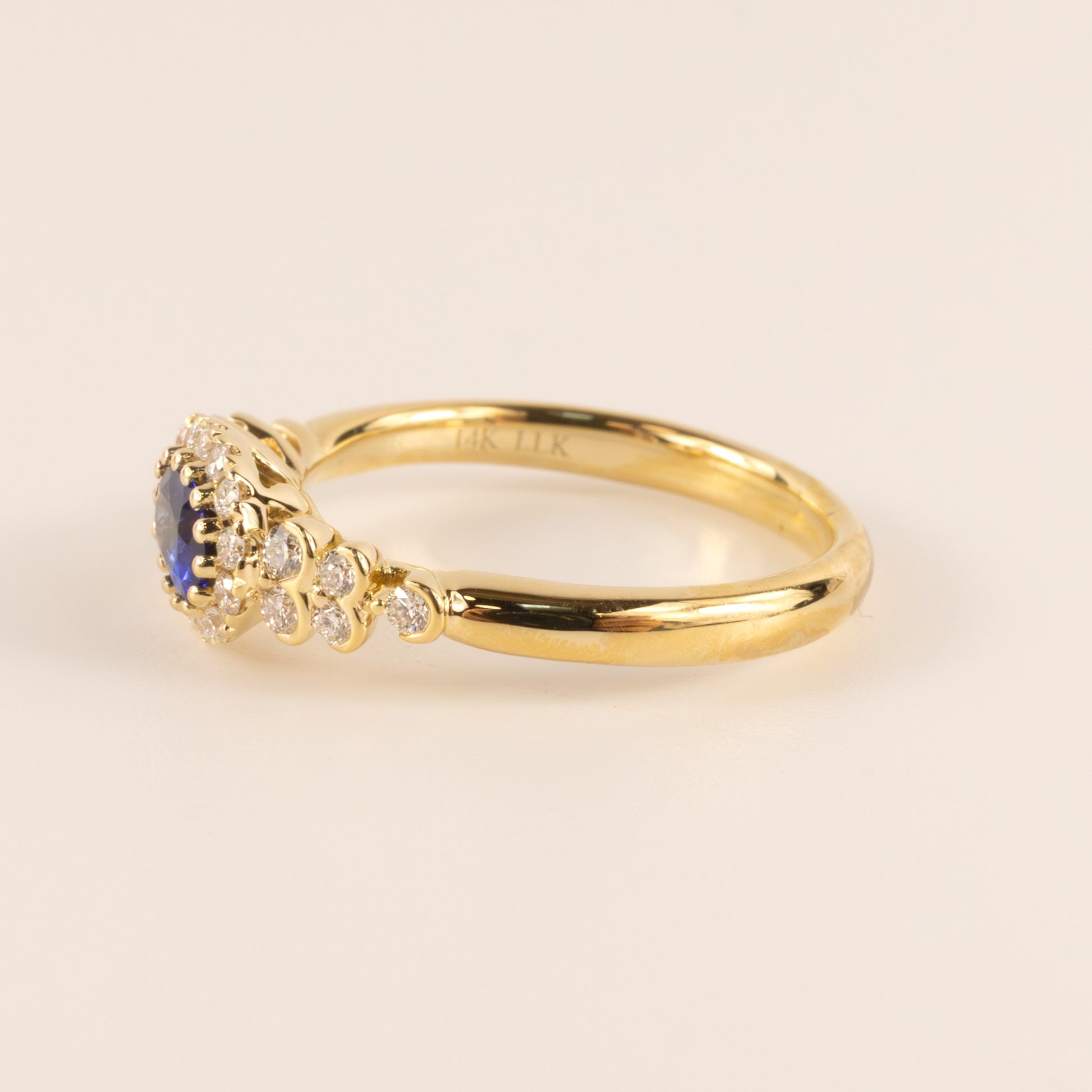 14KYG Sapphire Oval and Diamond Halo and Semi Bezel Accented Ring