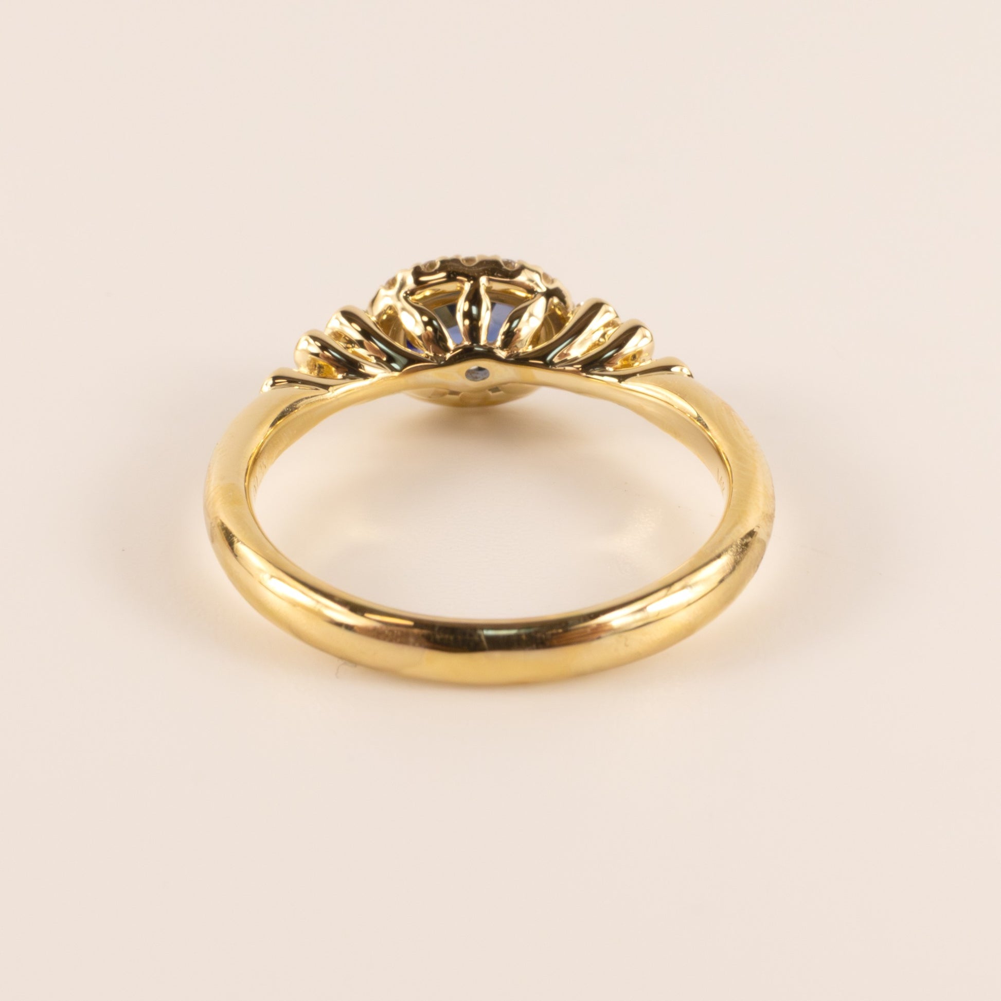14KYG Sapphire Oval and Diamond Halo and Semi Bezel Accented Ring