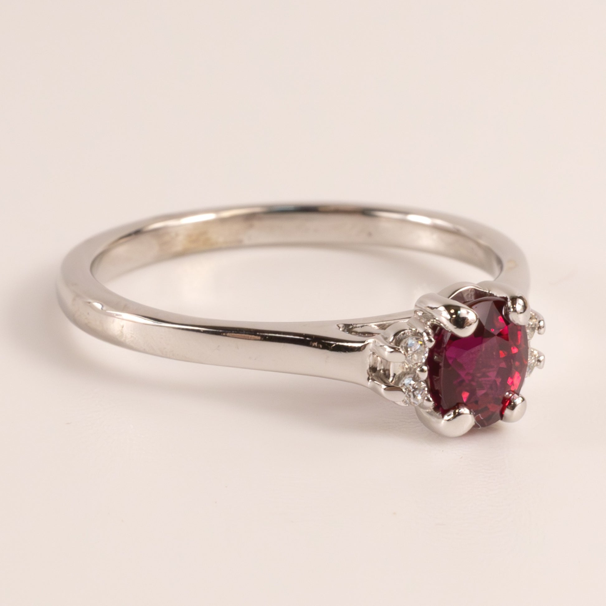 14KWG Ruby 0.50ct Oval and Diamond 0.04cttw Ring