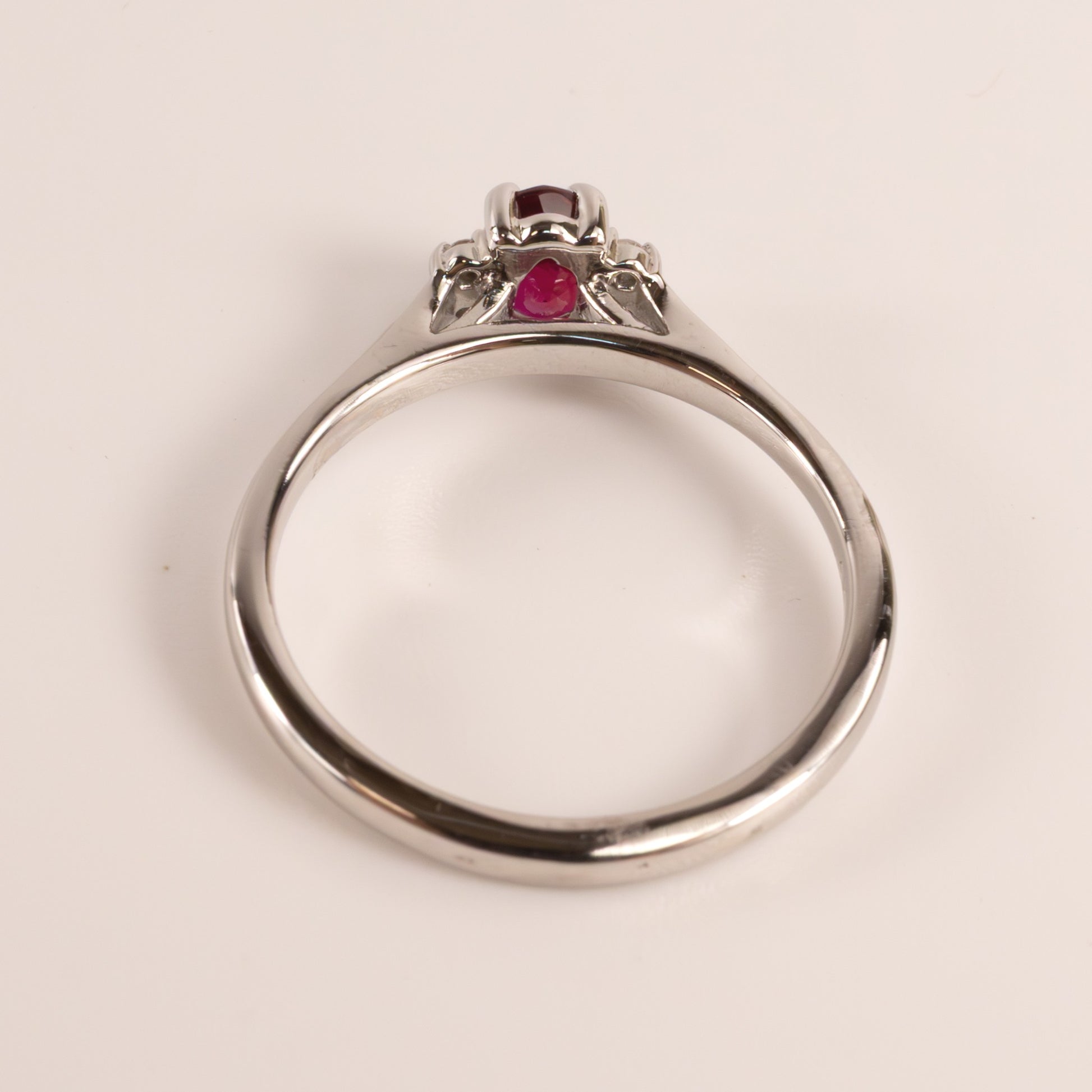 14KWG Ruby 0.50ct Oval and Diamond 0.04cttw Ring