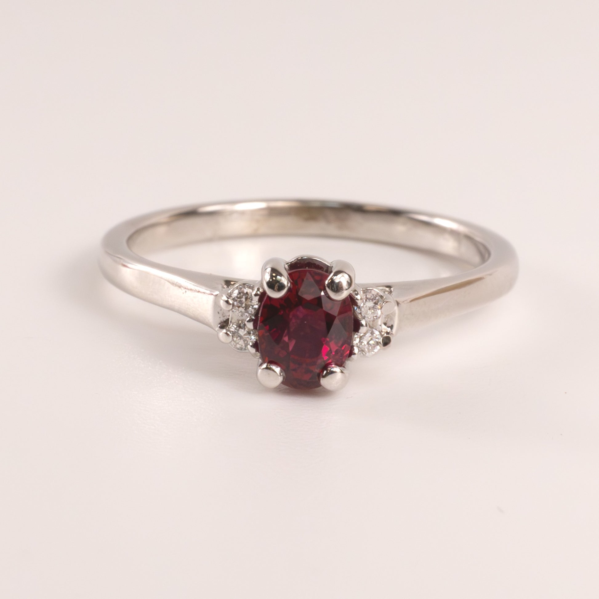 14KWG Ruby 0.50ct Oval and Diamond 0.04cttw Ring