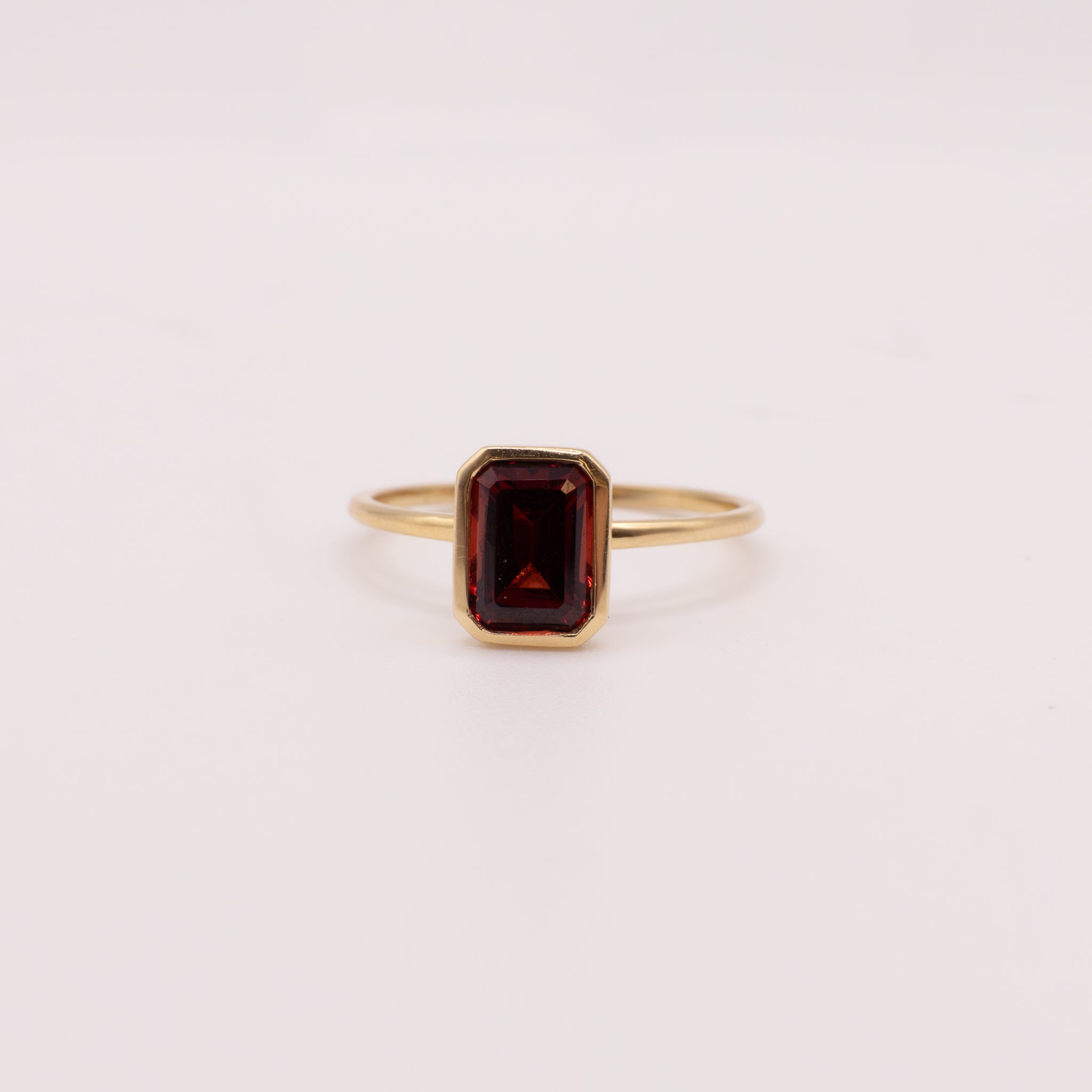 14KYG Garnet Emerald Cut Bezel Set Ring