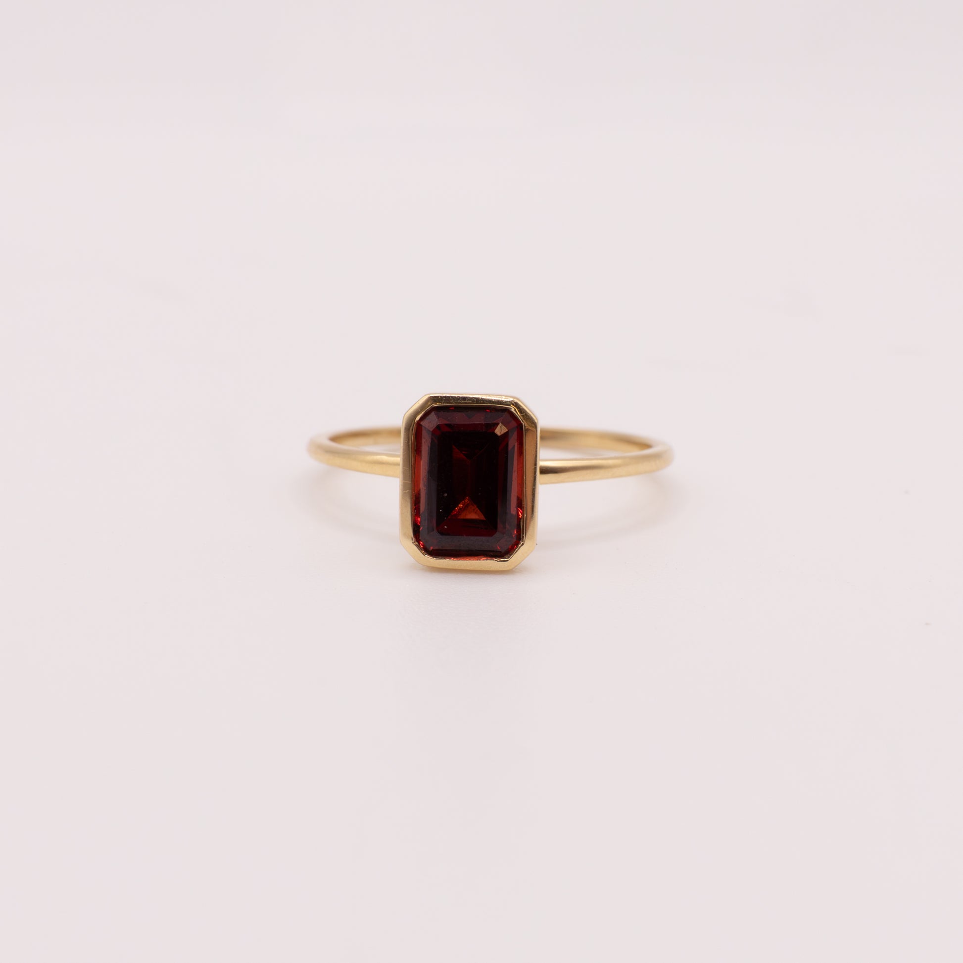 14KYG Garnet Emerald Cut Bezel Set Ring