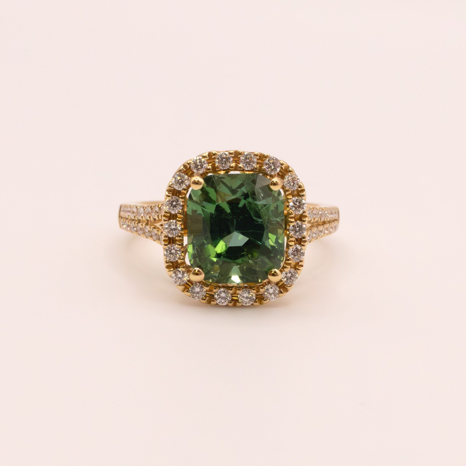 18KYG Green Tourmaline and Diamond Halo Ring