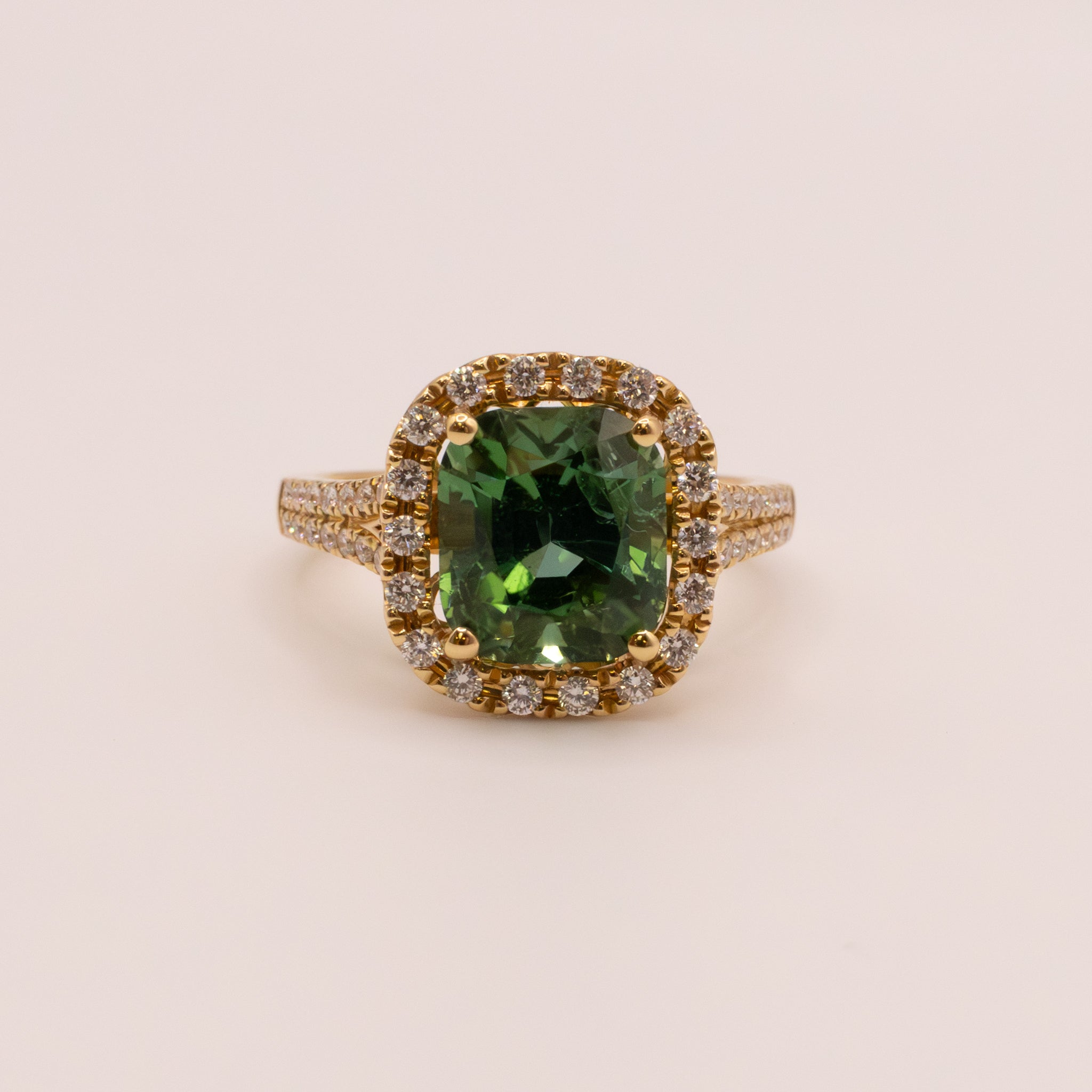 18KYG Green Tourmaline and Diamond Halo Ring