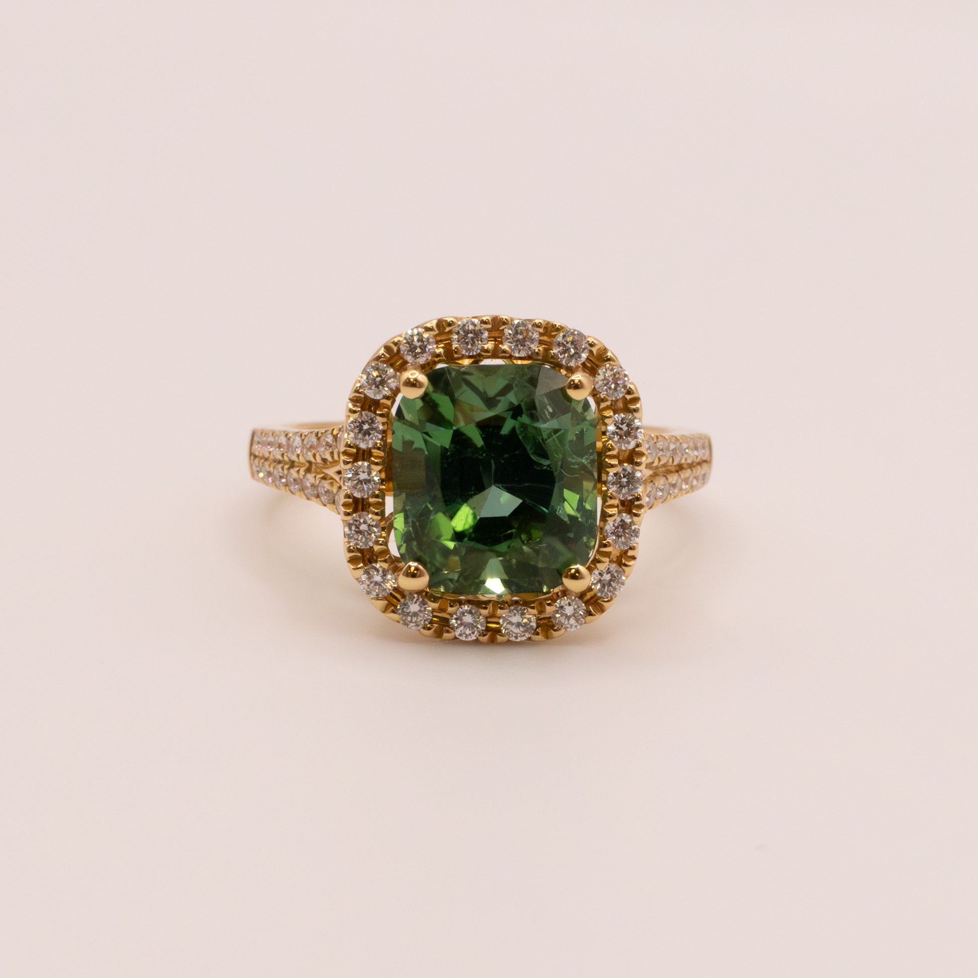 18KYG Green Tourmaline and Diamond Halo Ring