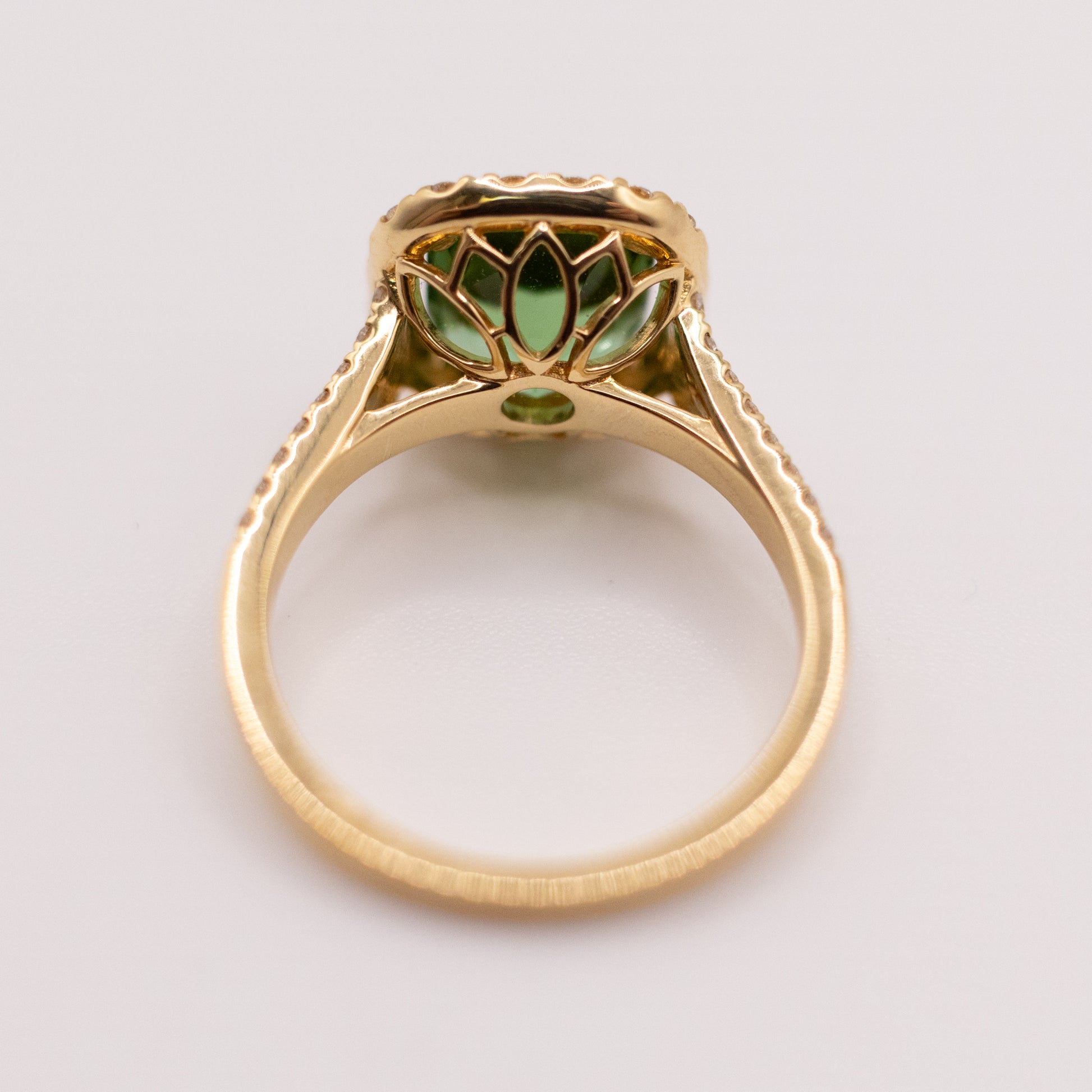 18KYG Green Tourmaline and Diamond Halo Ring