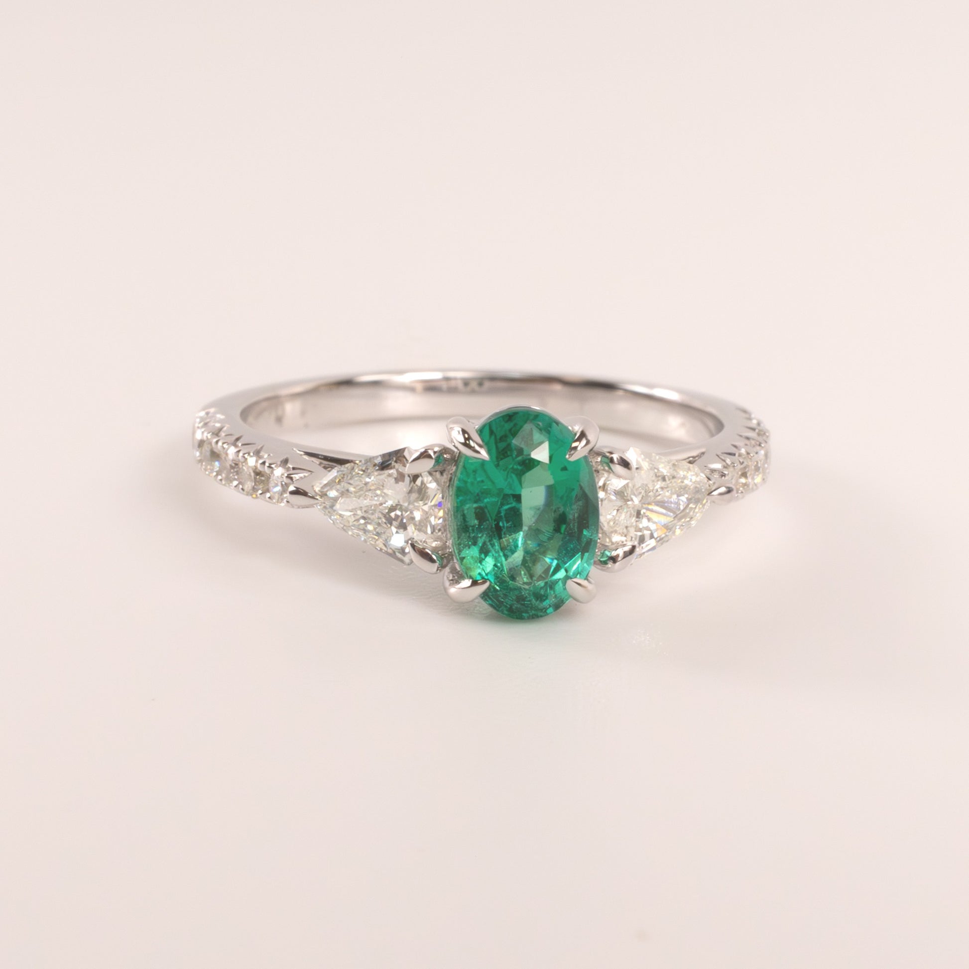14KWG Emerald Oval  and Diamond Shield Cut Accented Ring