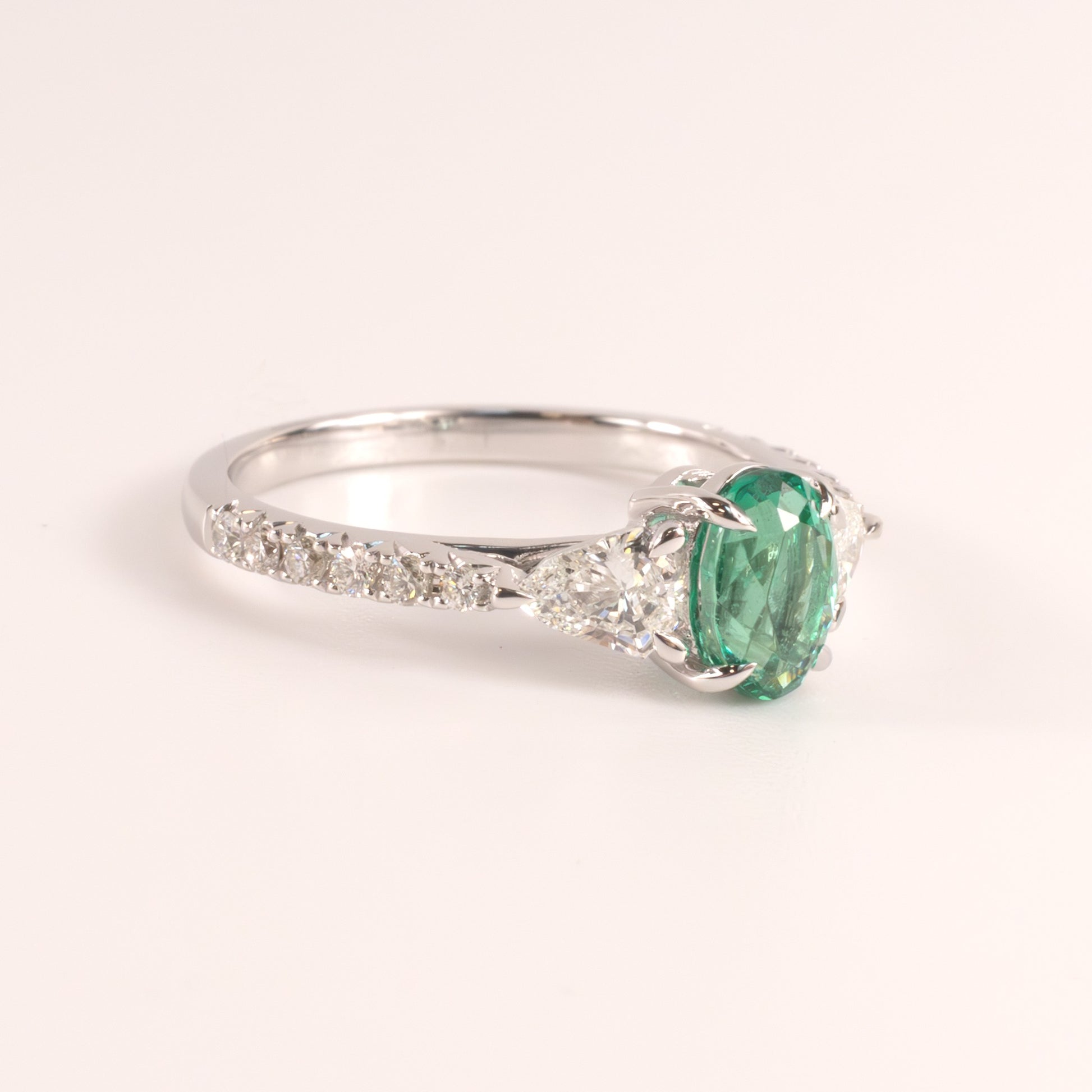 14KWG Emerald Oval  and Diamond Shield Cut Accented Ring