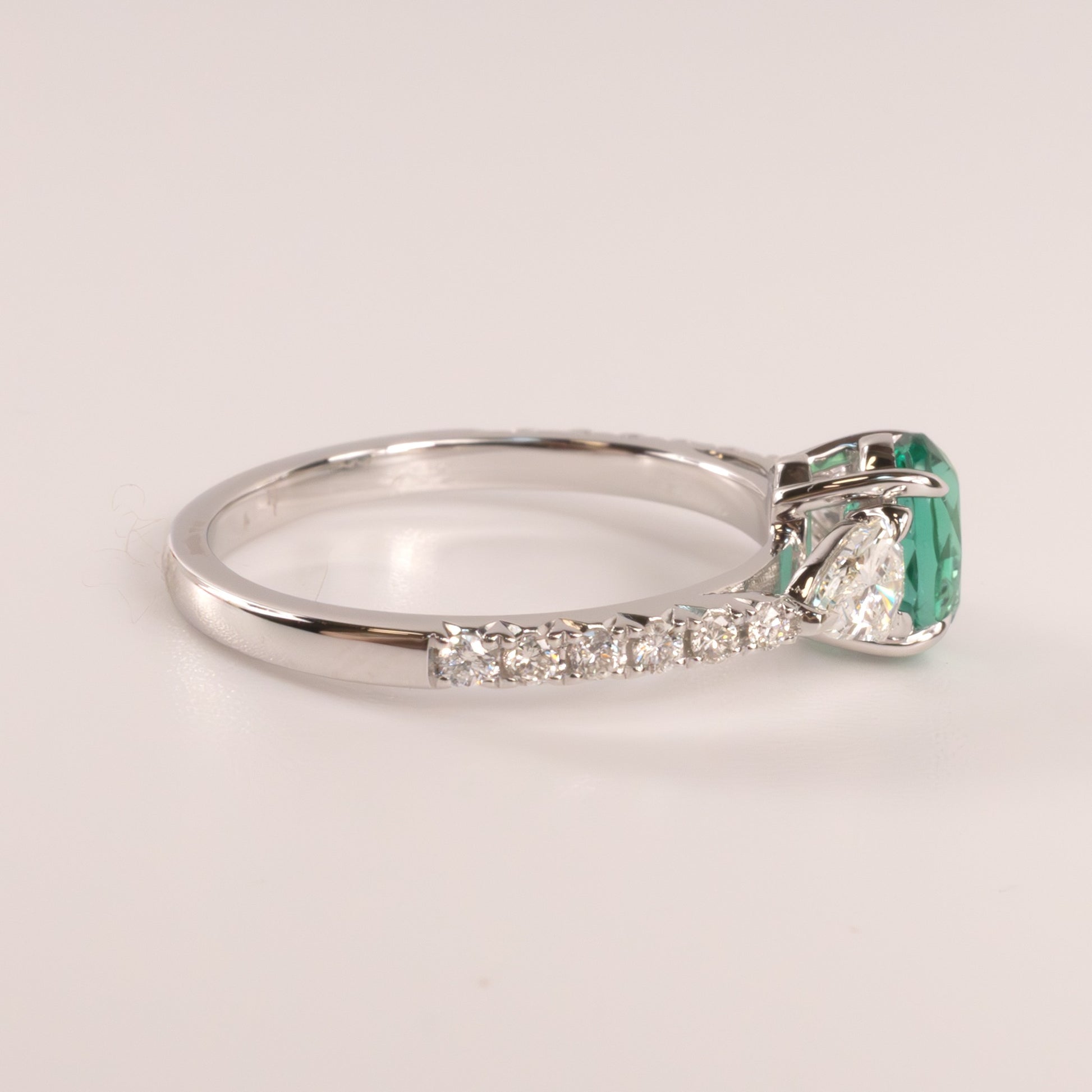 14KWG Emerald Oval  and Diamond Shield Cut Accented Ring