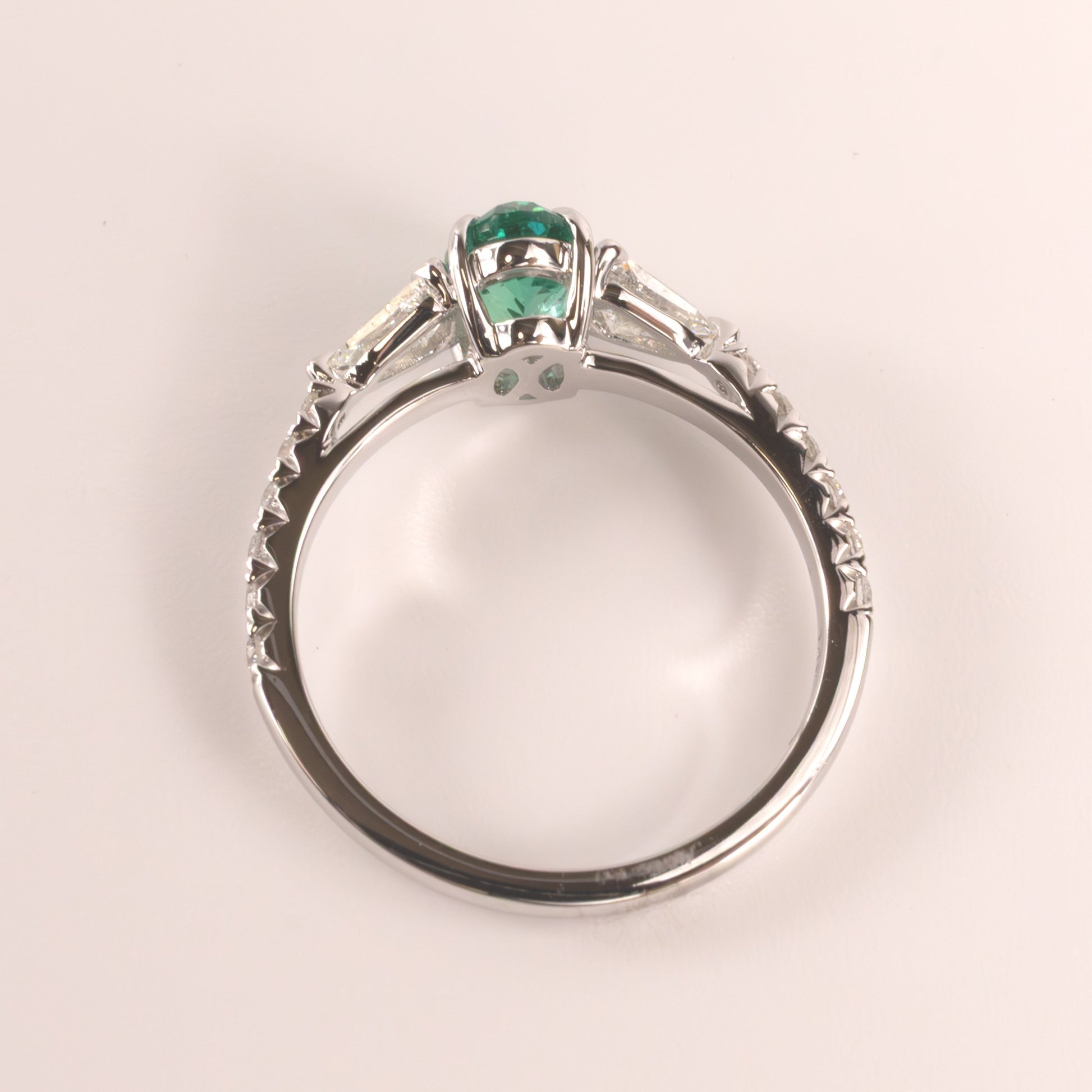 14KWG Emerald Oval  and Diamond Shield Cut Accented Ring