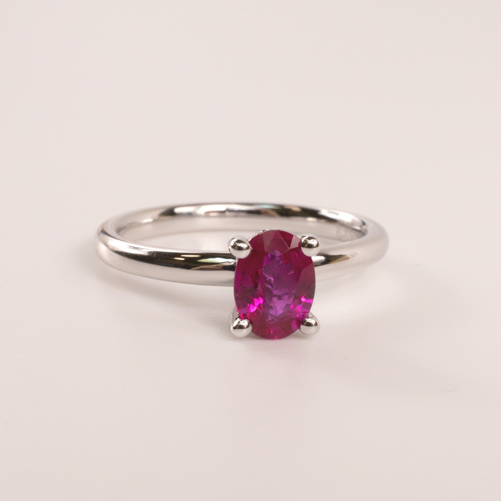 14KWG Ruby Oval with Hidden Diamond Halo Ring