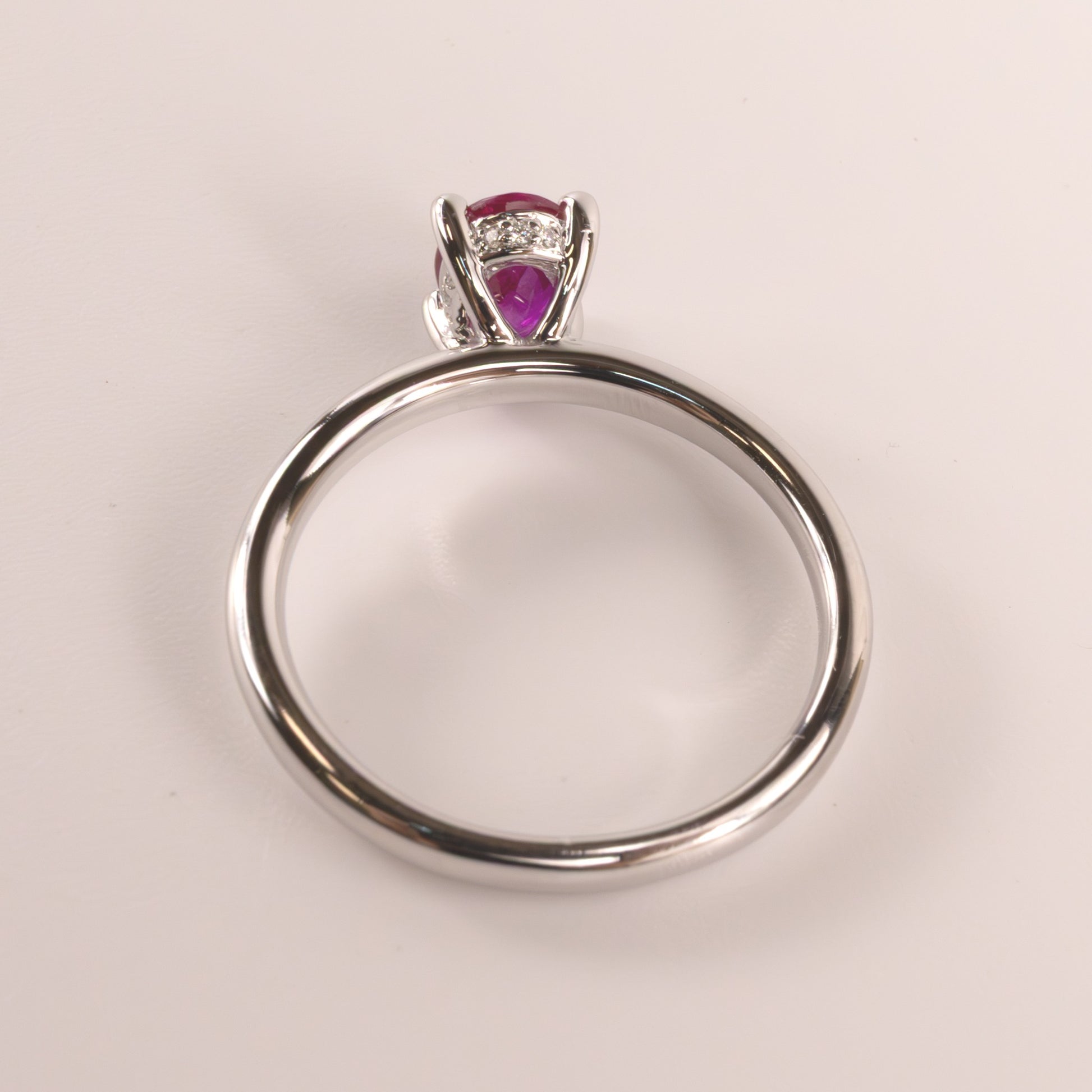 14KWG Ruby Oval with Hidden Diamond Halo Ring