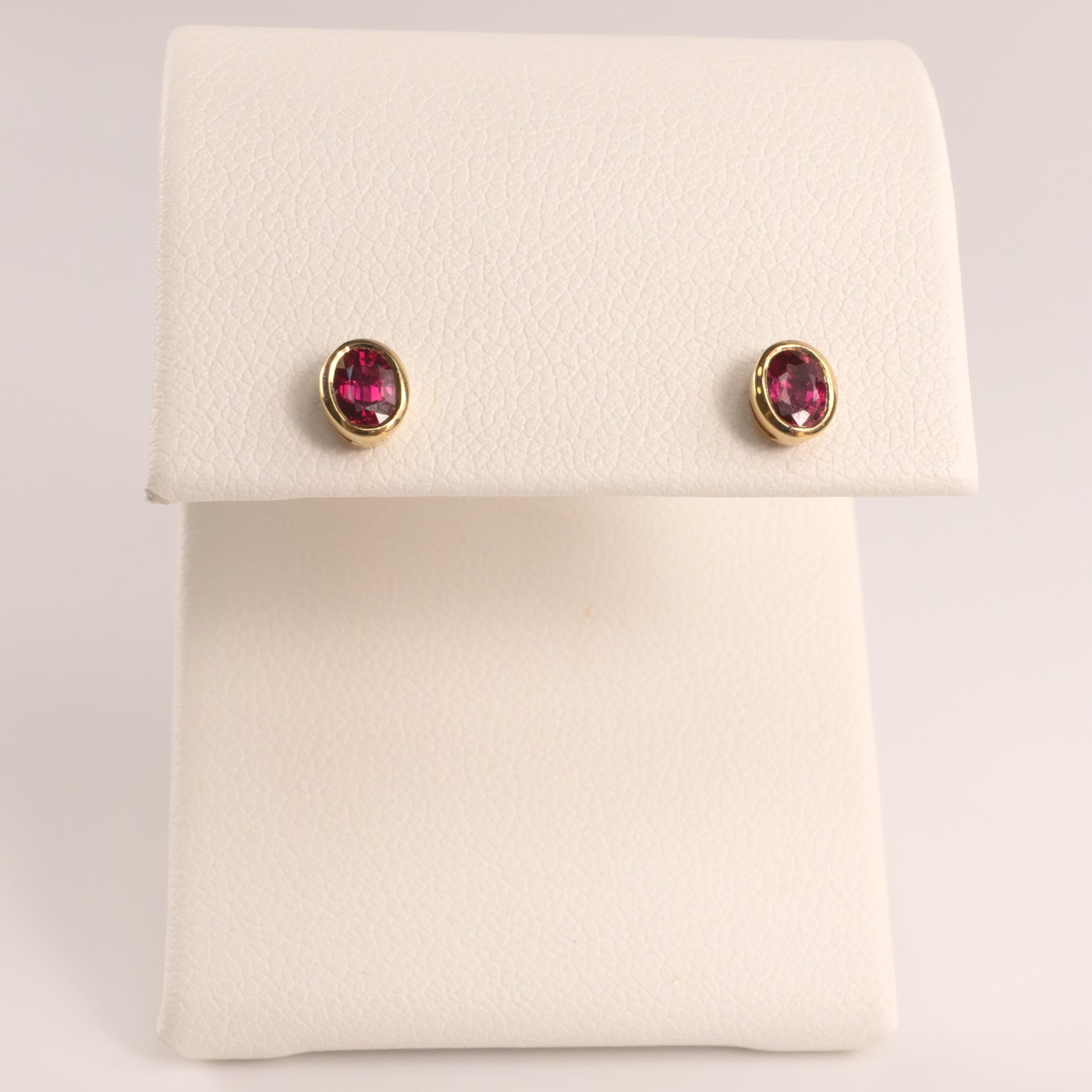 14KYG Ruby Bezel Set Oval Stud Earrings