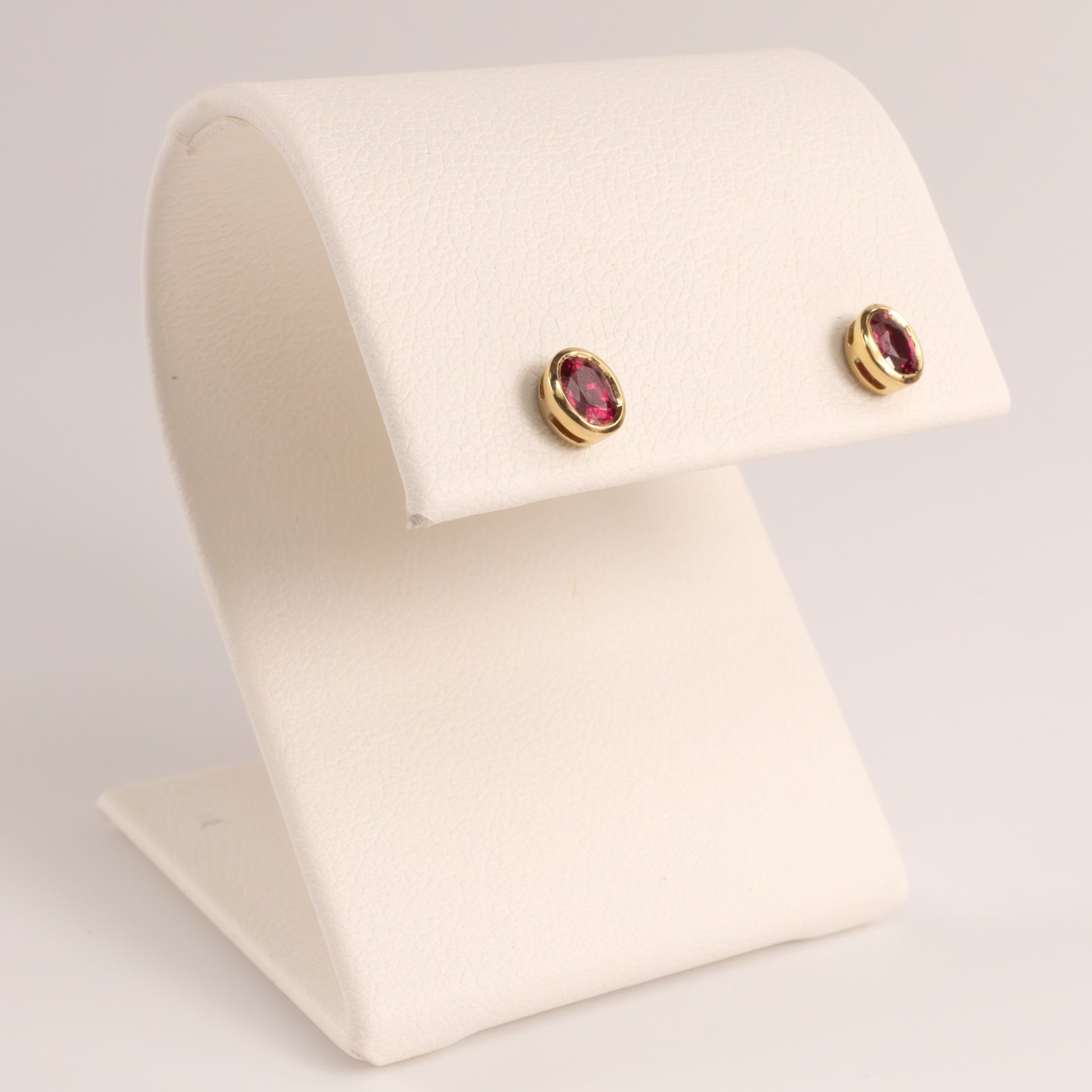 14KYG Ruby Bezel Set Oval Stud Earrings