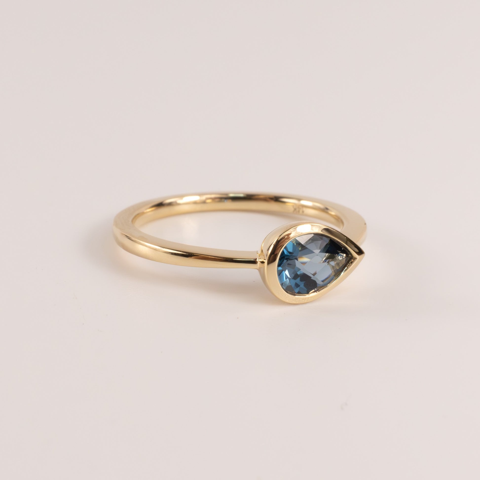 14KYG London Blue Topaz Pear Cut East-West Bezel Set Ring