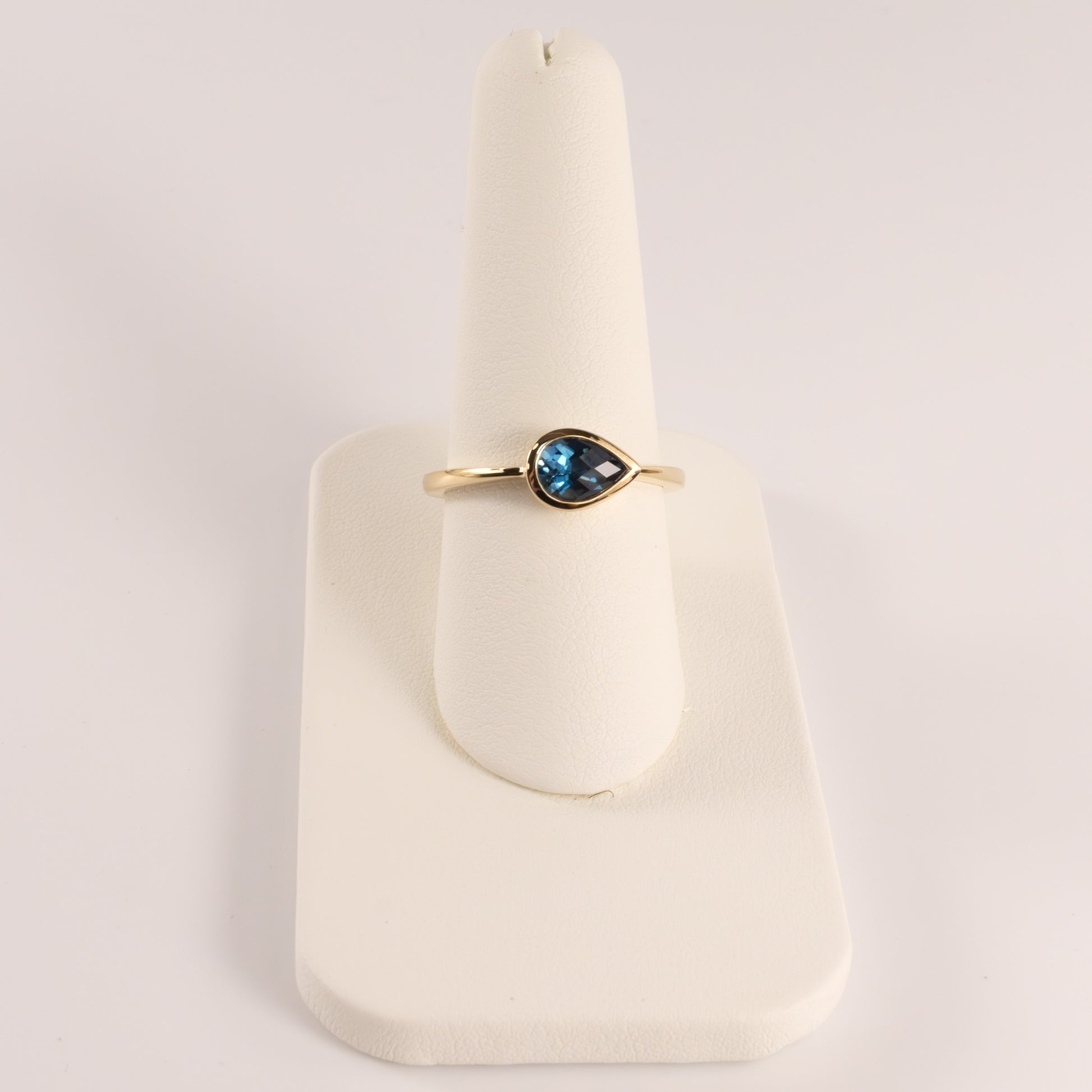 14KYG London Blue Topaz Pear Cut East-West Bezel Set Ring