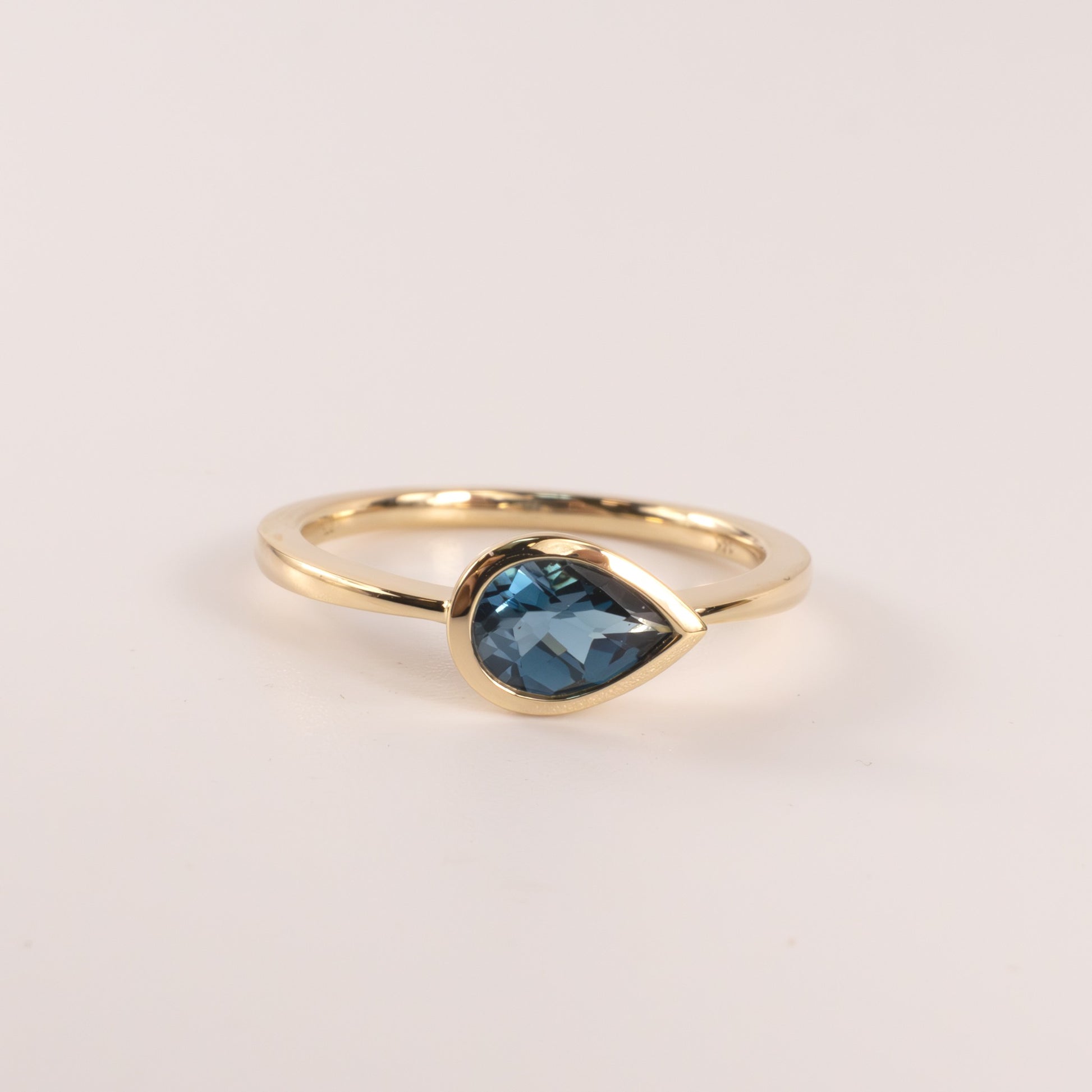 14KYG London Blue Topaz Pear Cut East-West Bezel Set Ring