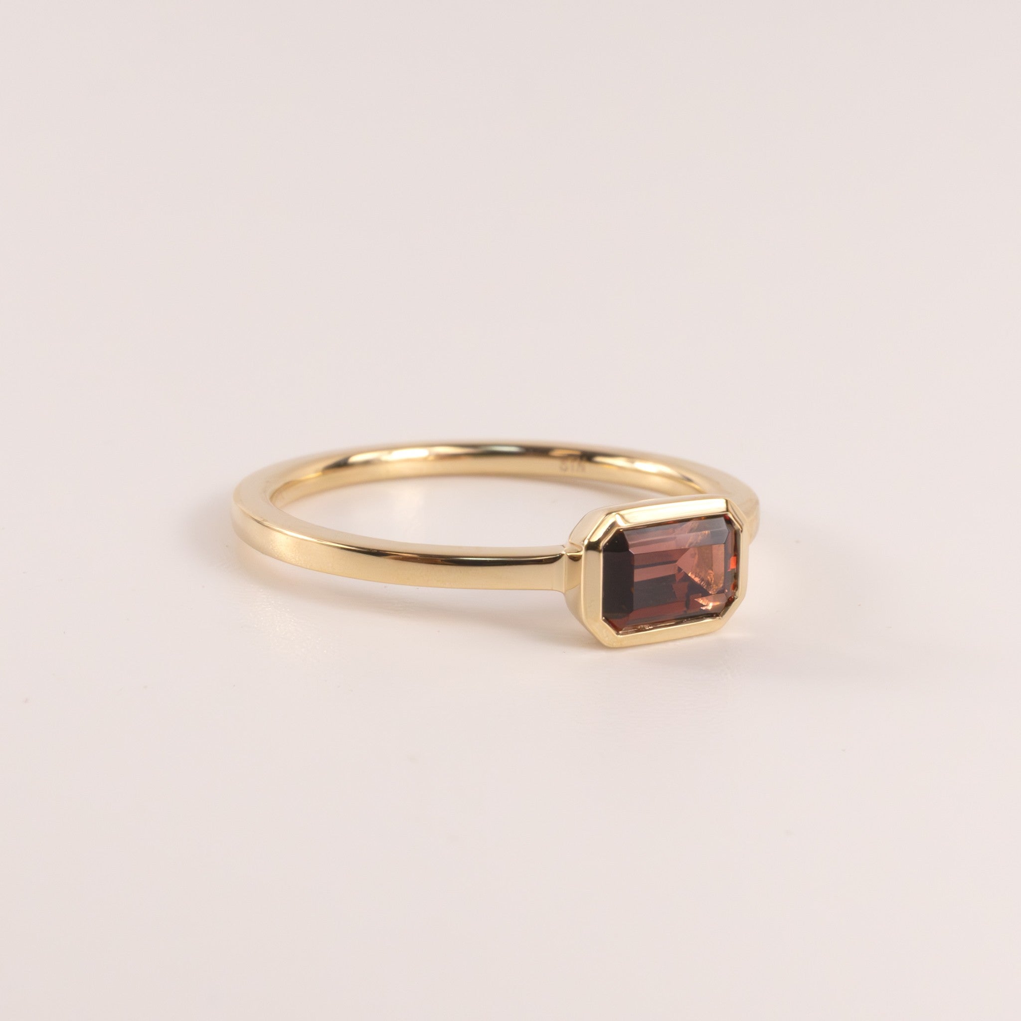 14KYG Garnet Emerald Cut East-West Bezel Set Ring