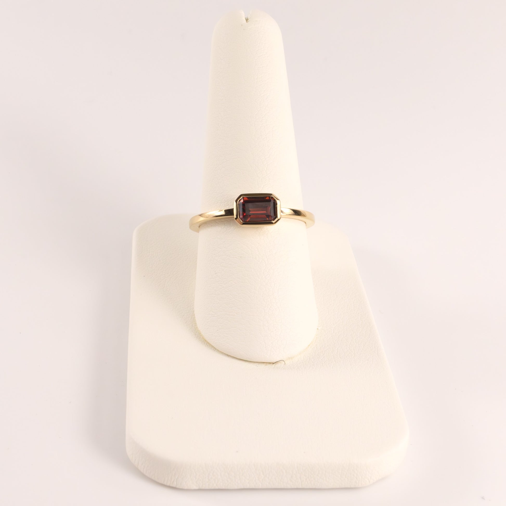 14KYG Garnet Emerald Cut East-West Bezel Set Ring