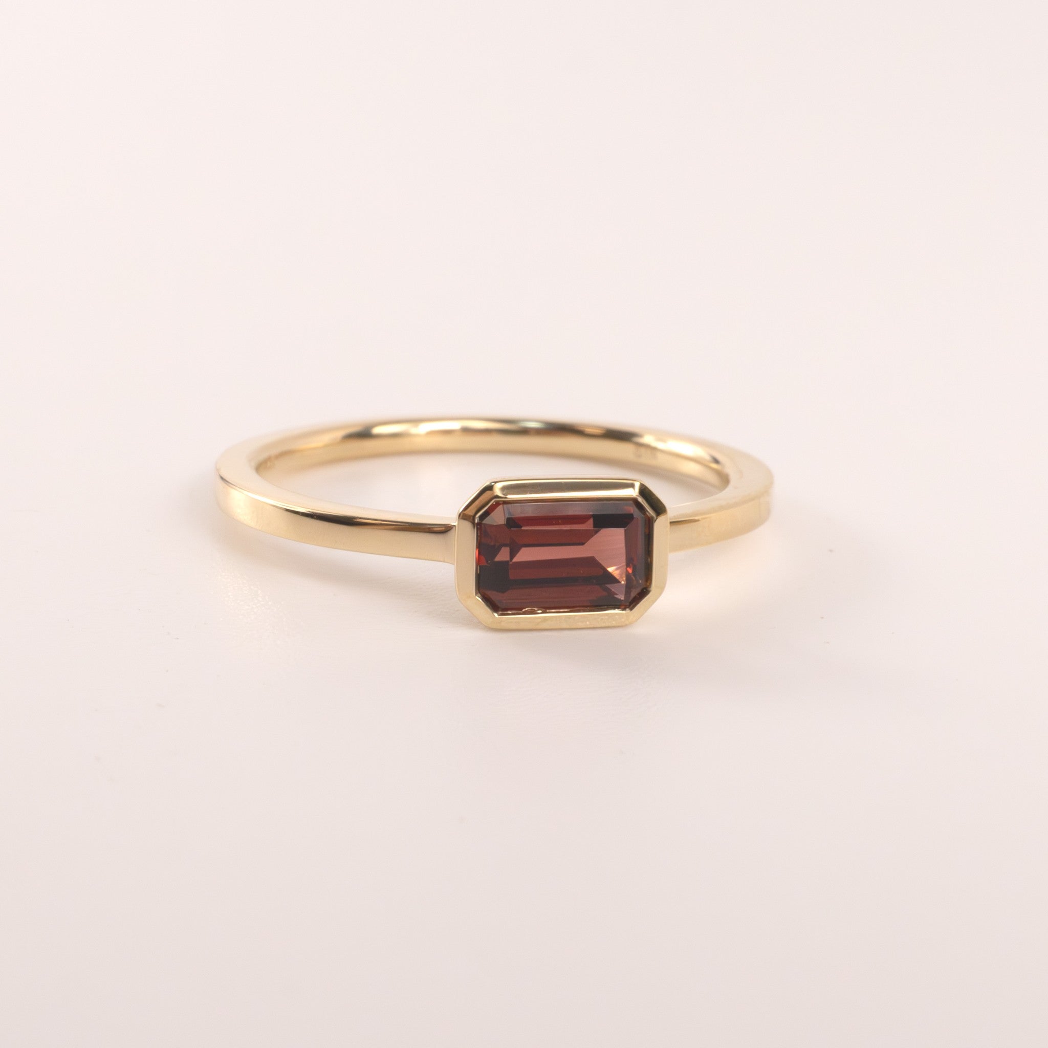 14KYG Garnet Emerald Cut East-West Bezel Set Ring