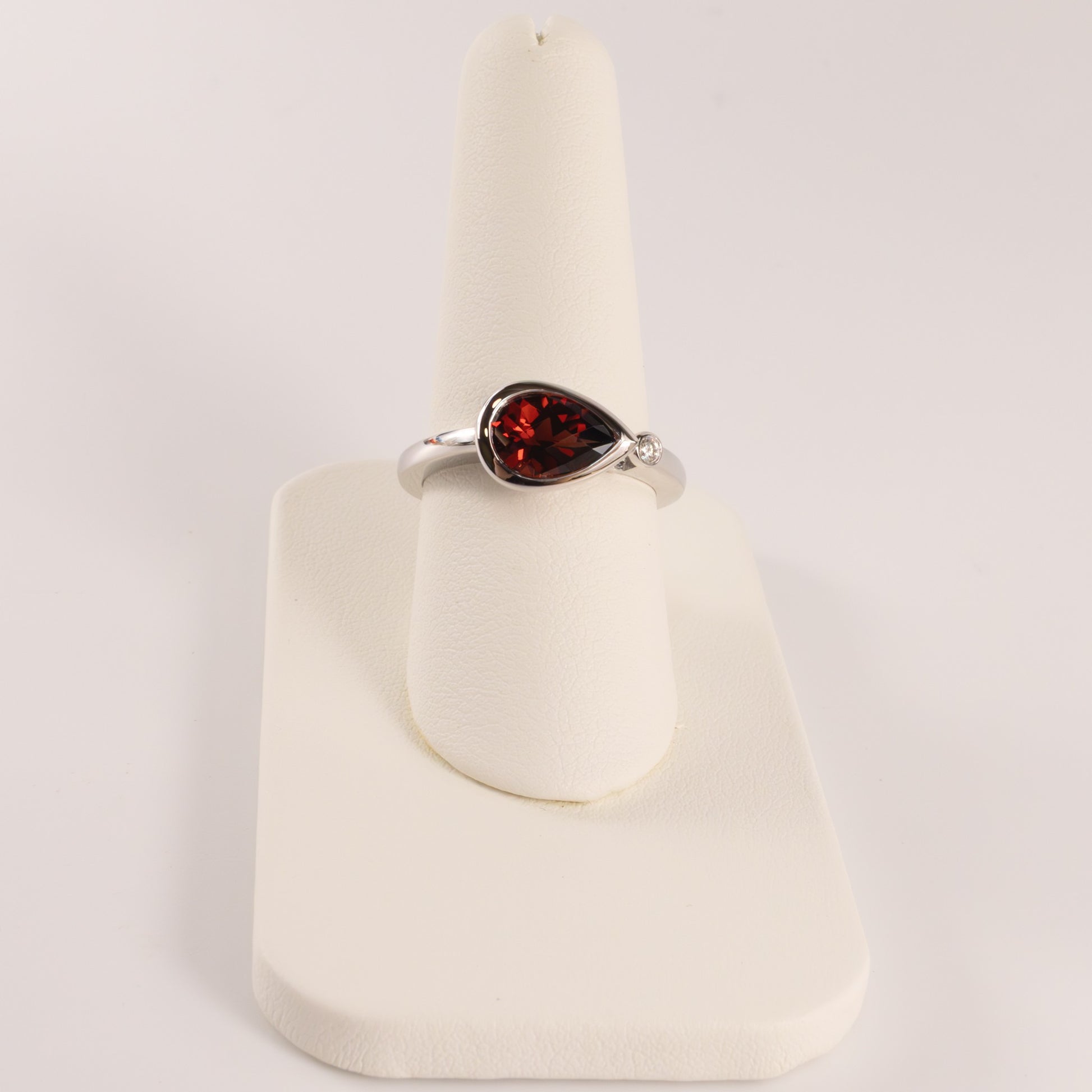 14KWG Garnet Pear and Diamond East-West Bezel Set Ring