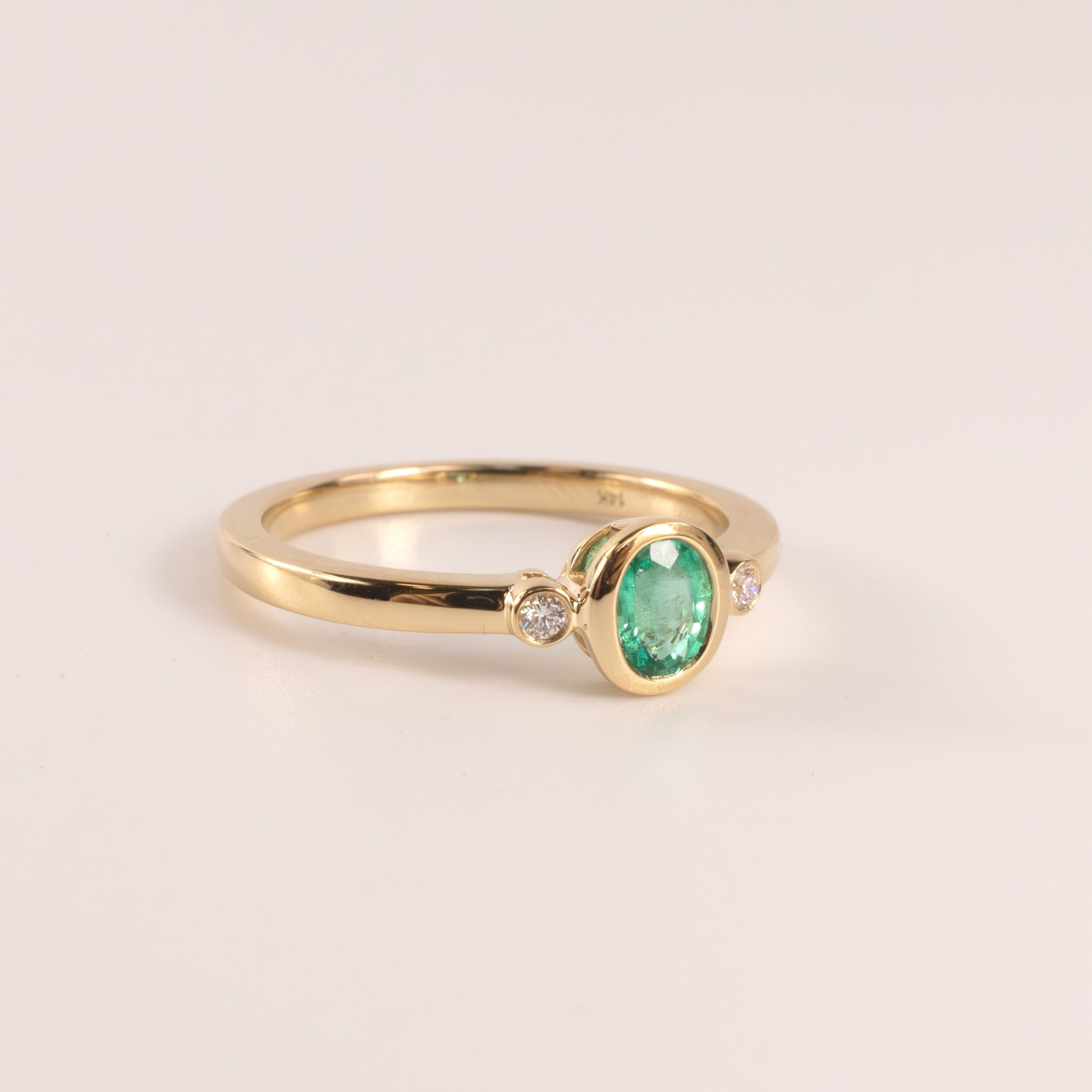 14KYG Emerald Oval and Diamon 3-Stone Bezel Set Ring