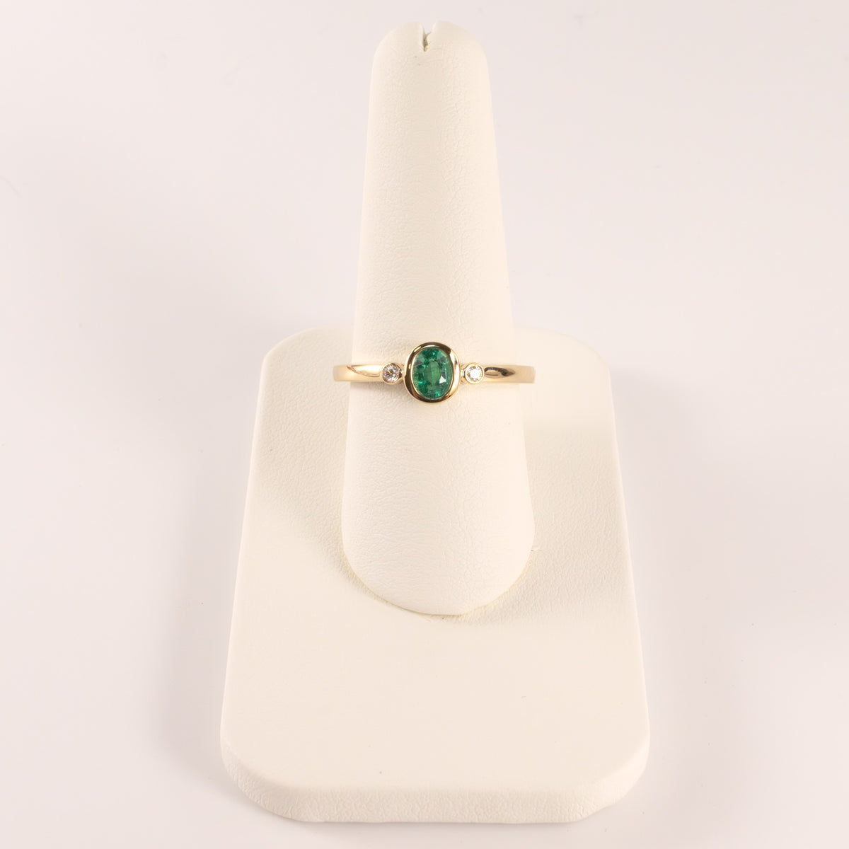 14KYG Emerald Oval and Diamond 3-Stone Bezel Set Ring