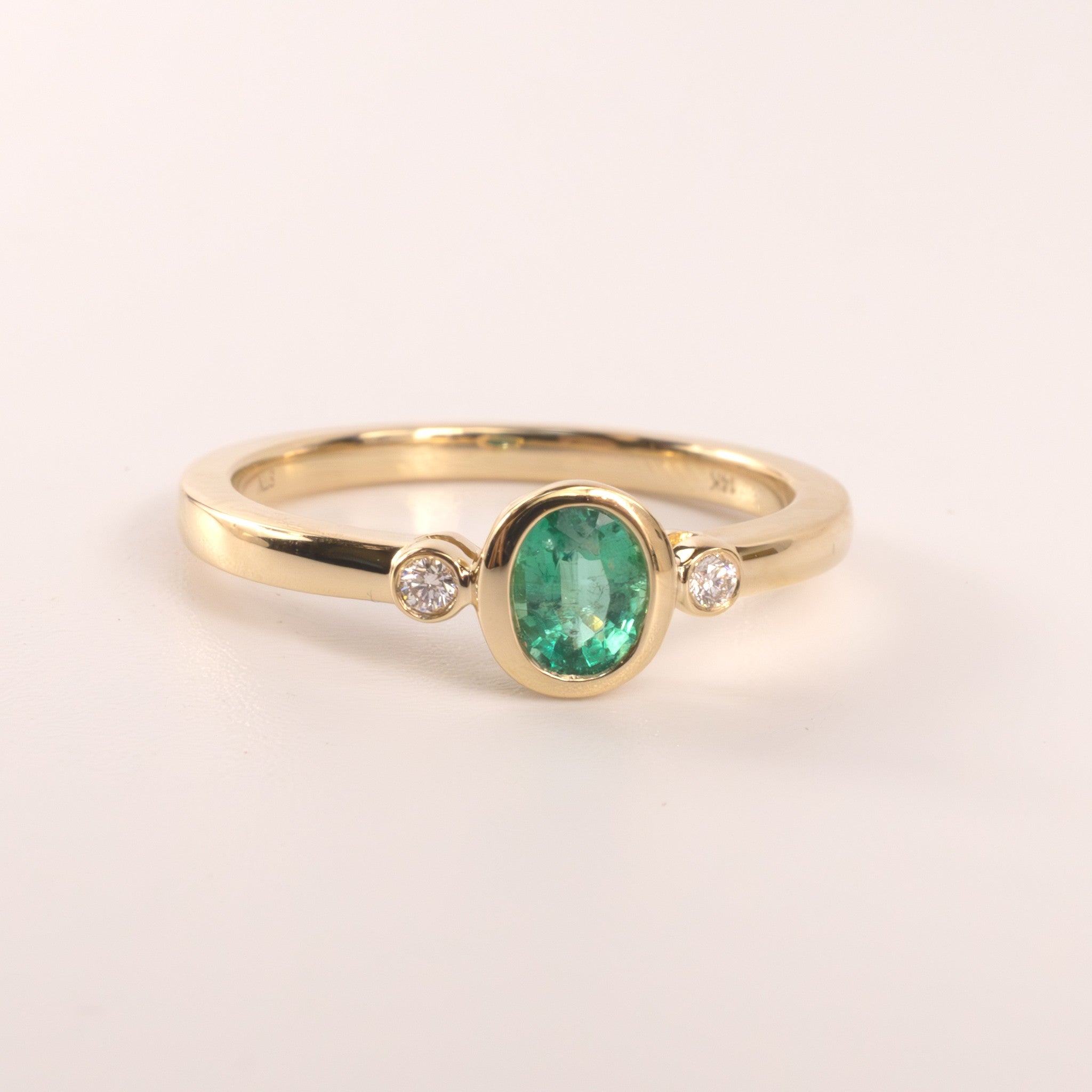 14KYG Emerald Oval and Diamon 3-Stone Bezel Set Ring