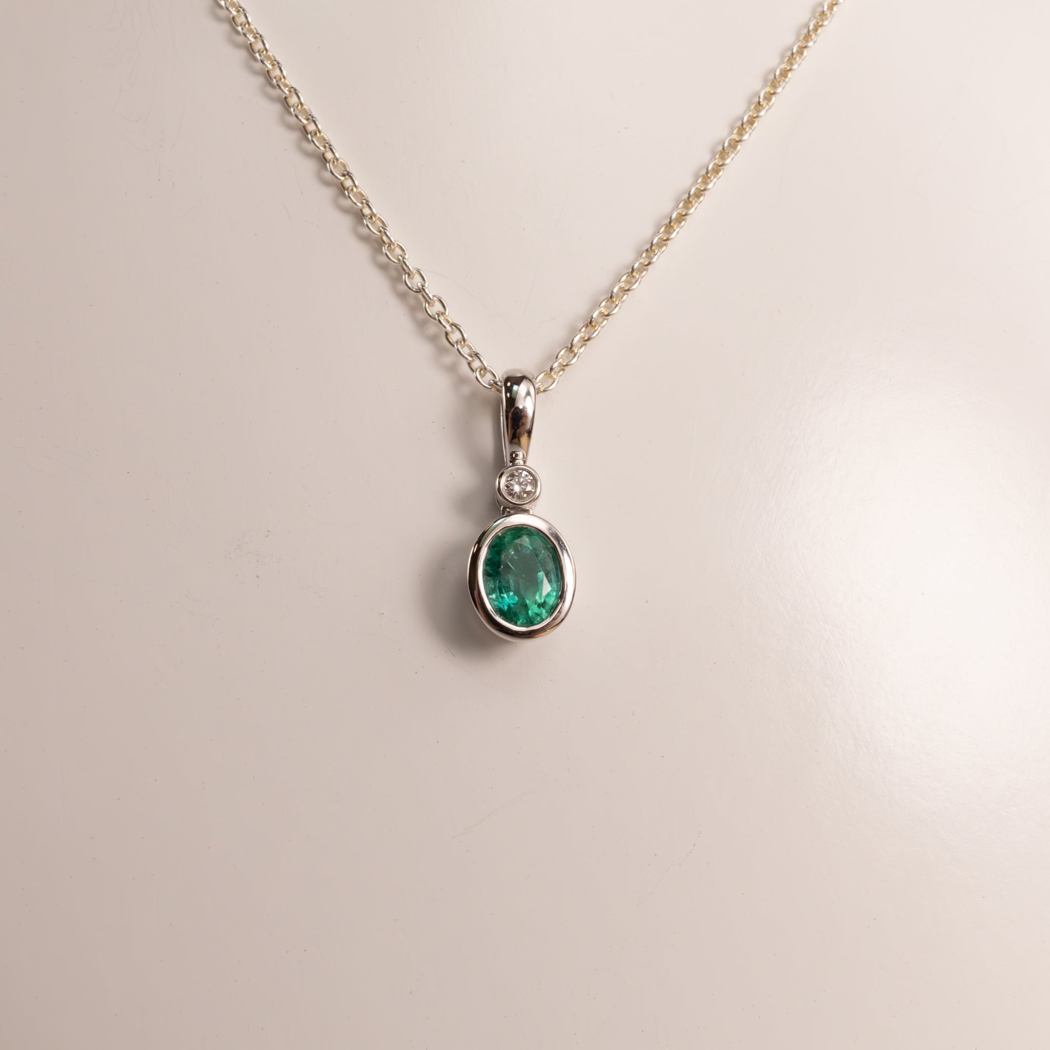14KWG Emerald Oval and Diamond Bezel Set Pendant