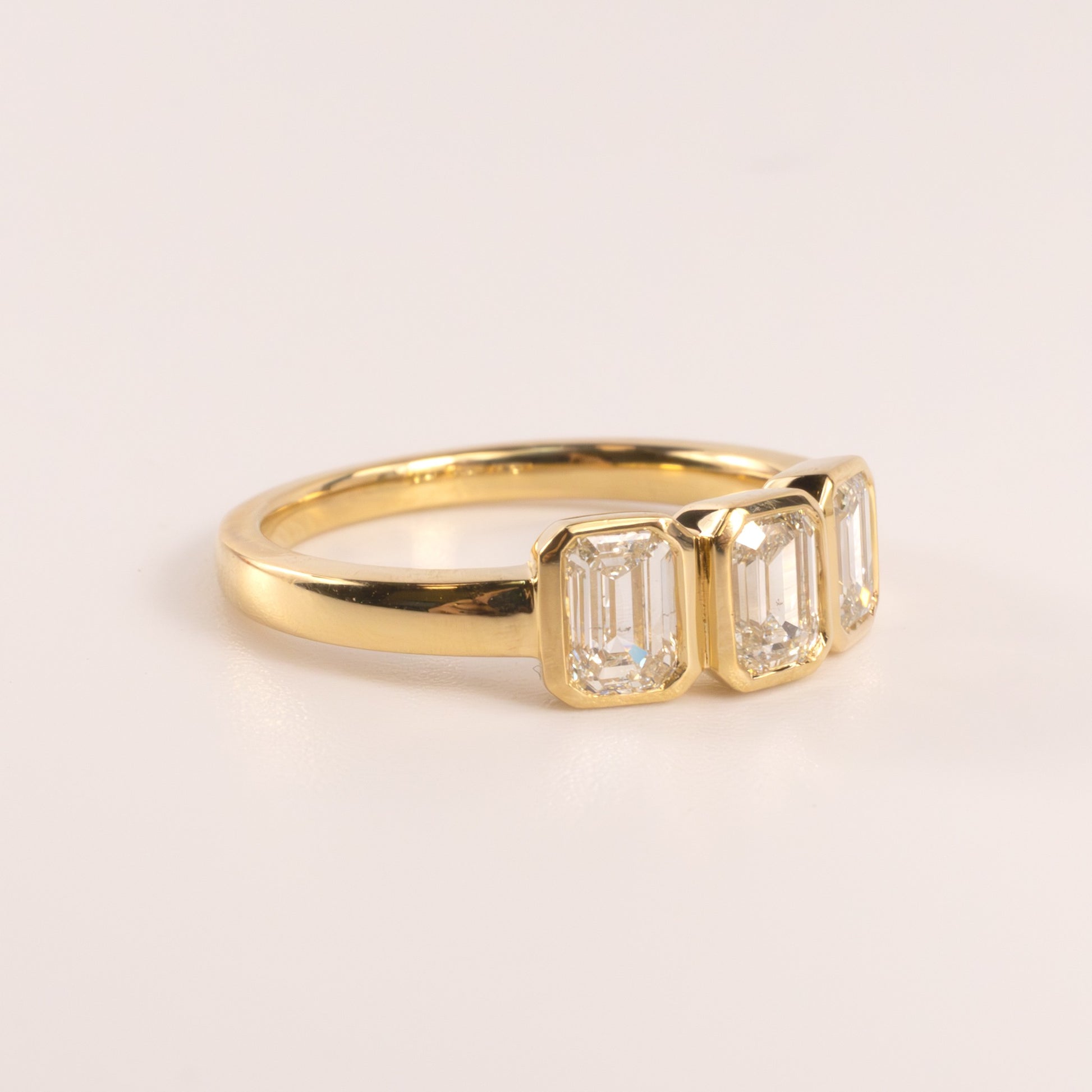 18KYG Diamond 1.25cttw Emerald Cut Bezel Set 3-Stone Ring