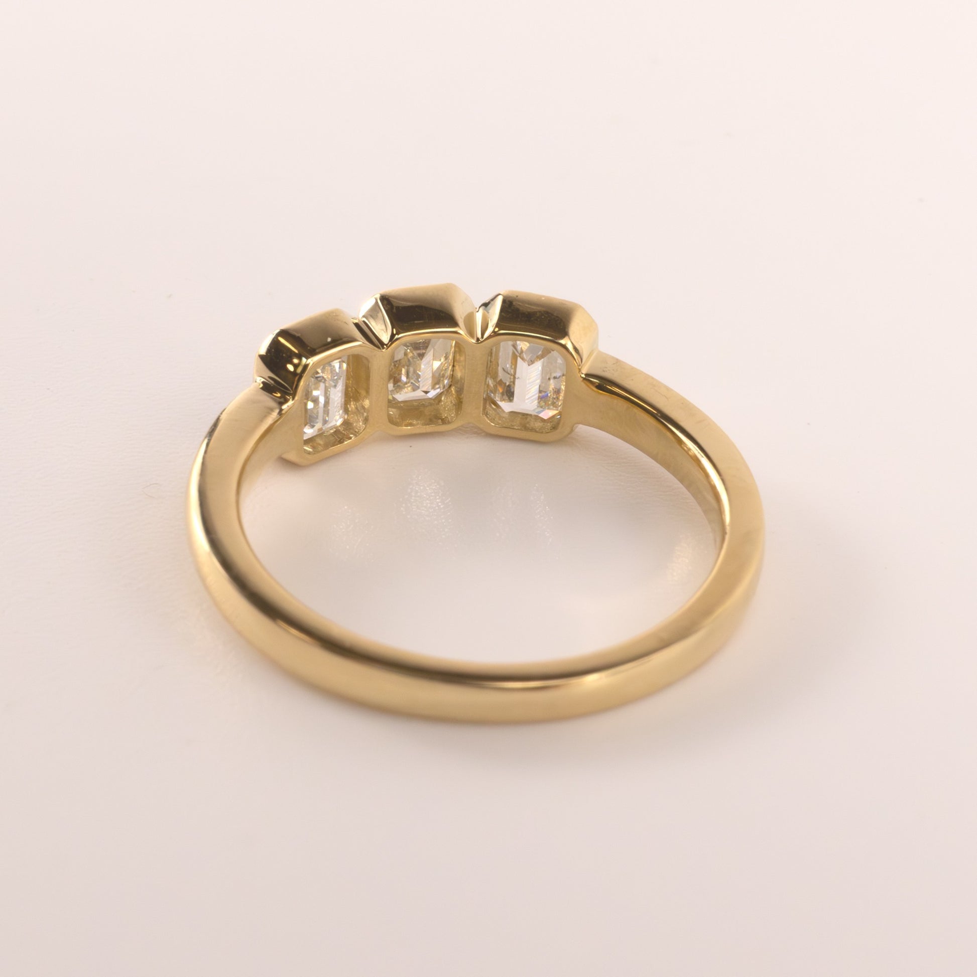 18KYG Diamond 1.25cttw Emerald Cut Bezel Set 3-Stone Ring