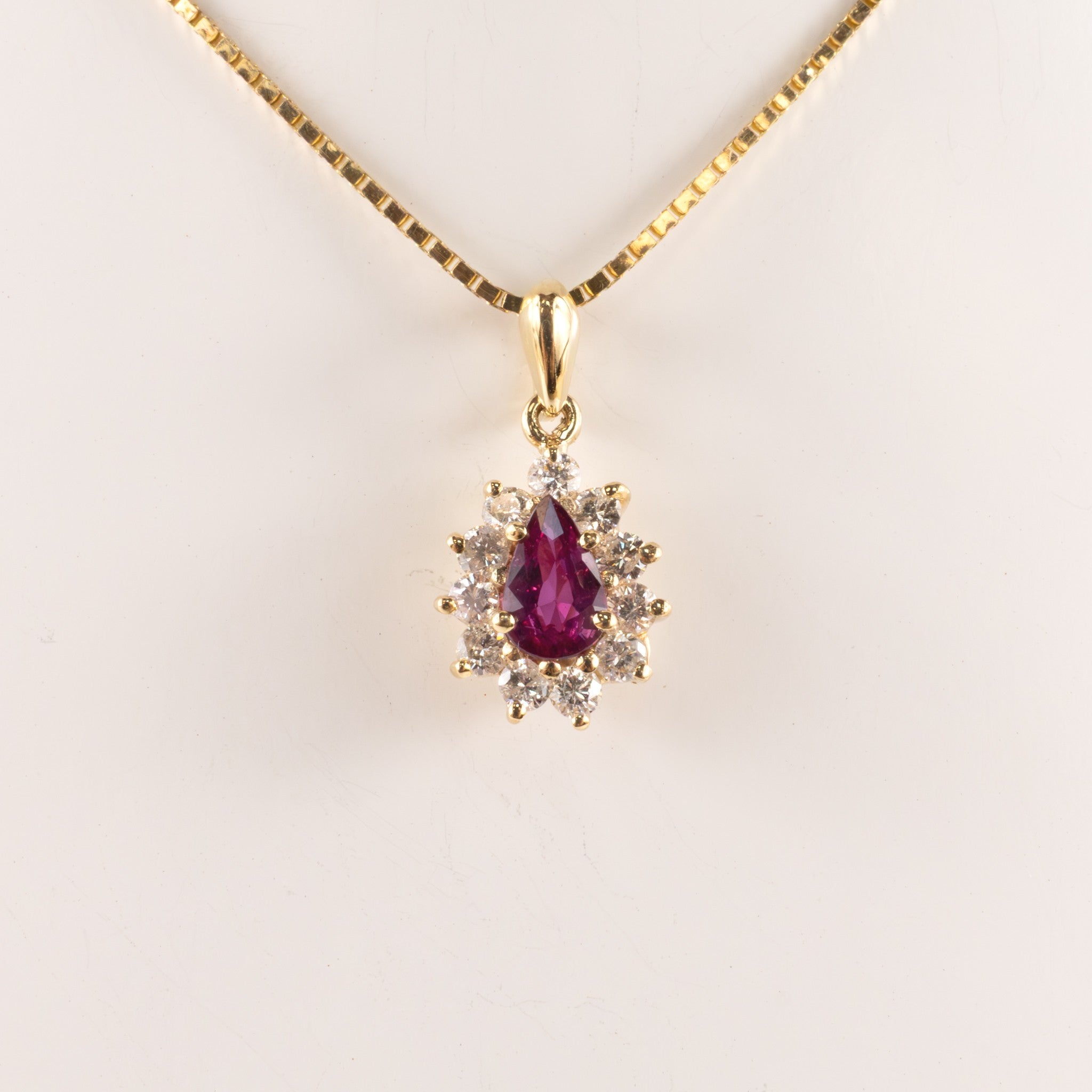 14KYG Ruby Pear and Diamond Halo Necklace