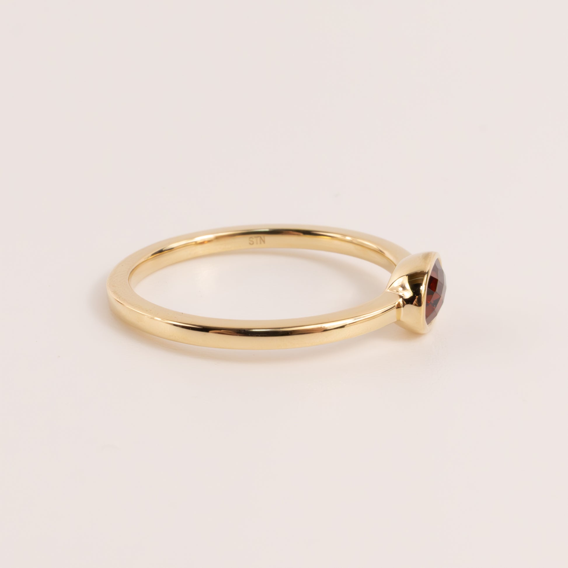 14KYG Garnet Oval Bezel Set East-West Ring