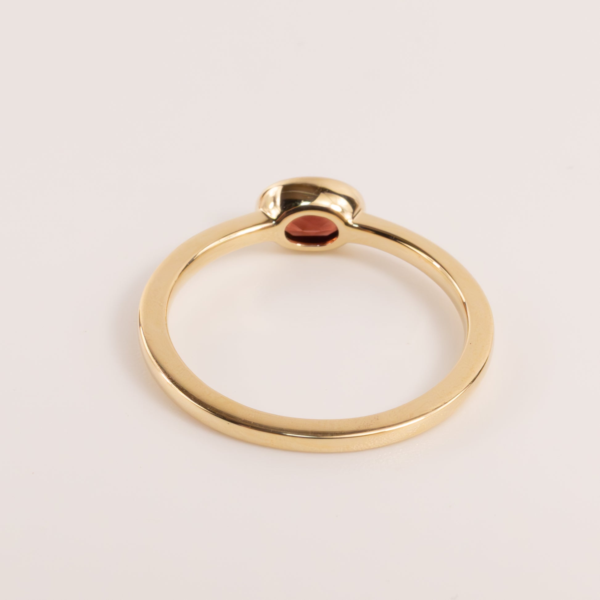 14KYG Garnet Oval Bezel Set East-West Ring