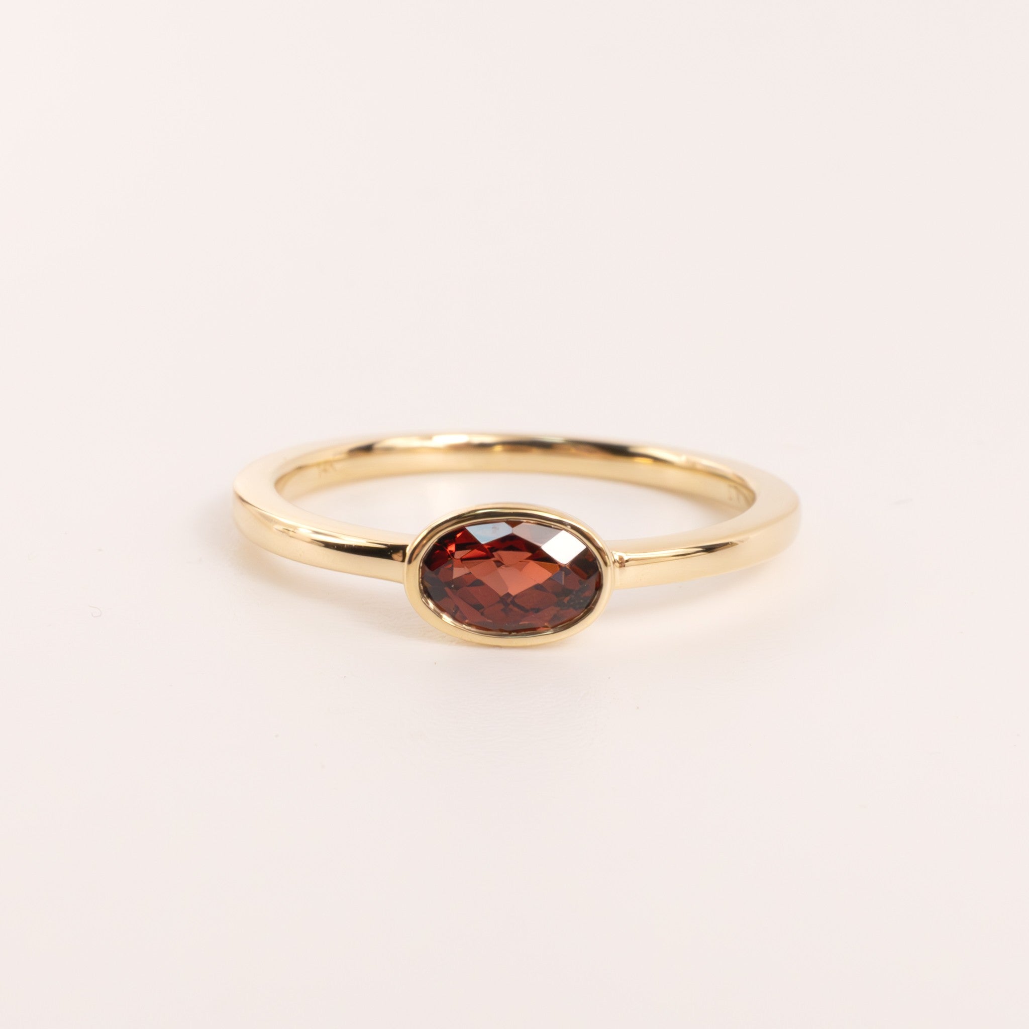 14KYG Garnet Oval Bezel Set East-West Ring