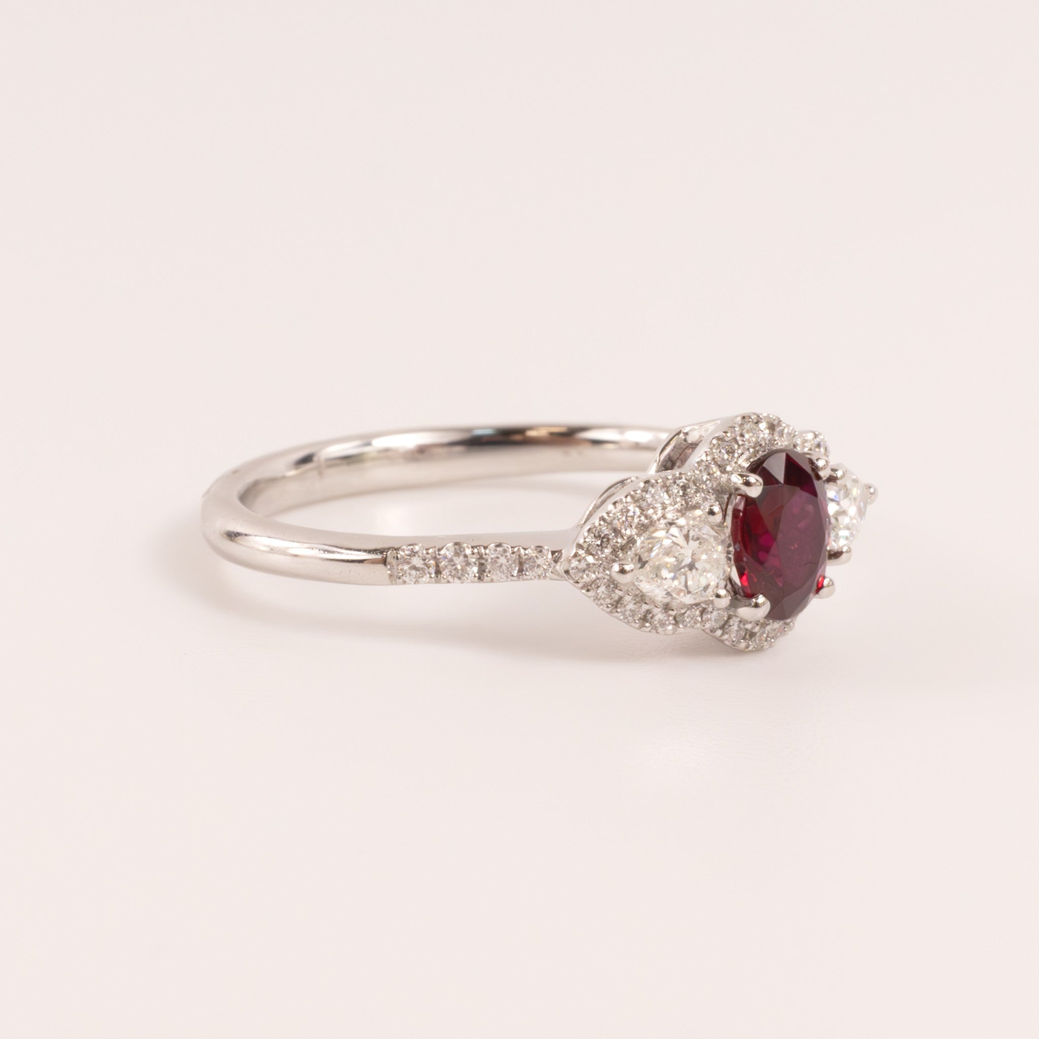 14KWG Ruby Oval with Diamond Pears and Halo Ring