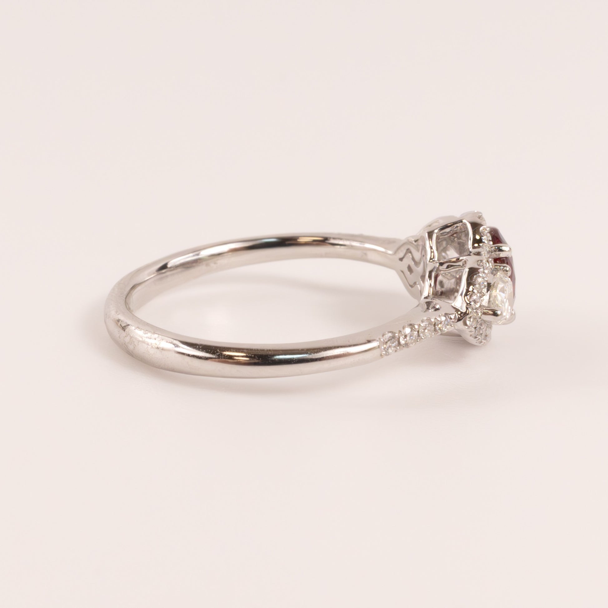 14KWG Ruby Oval with Diamond Pears and Halo Ring