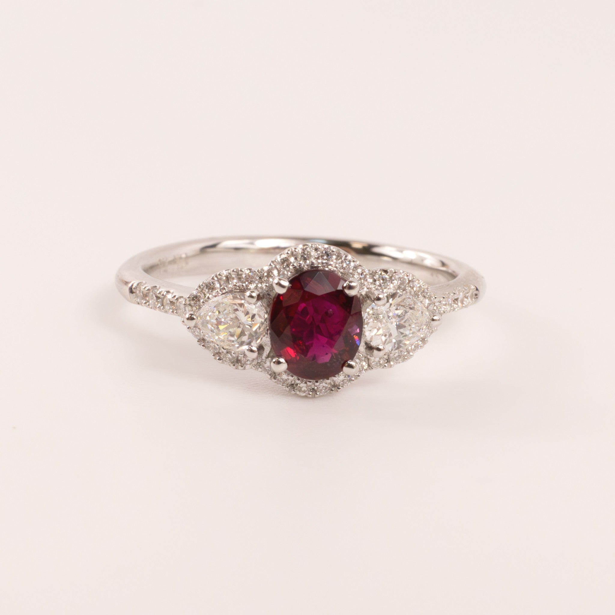 14KWG Ruby Oval with Diamond Pears and Halo Ring