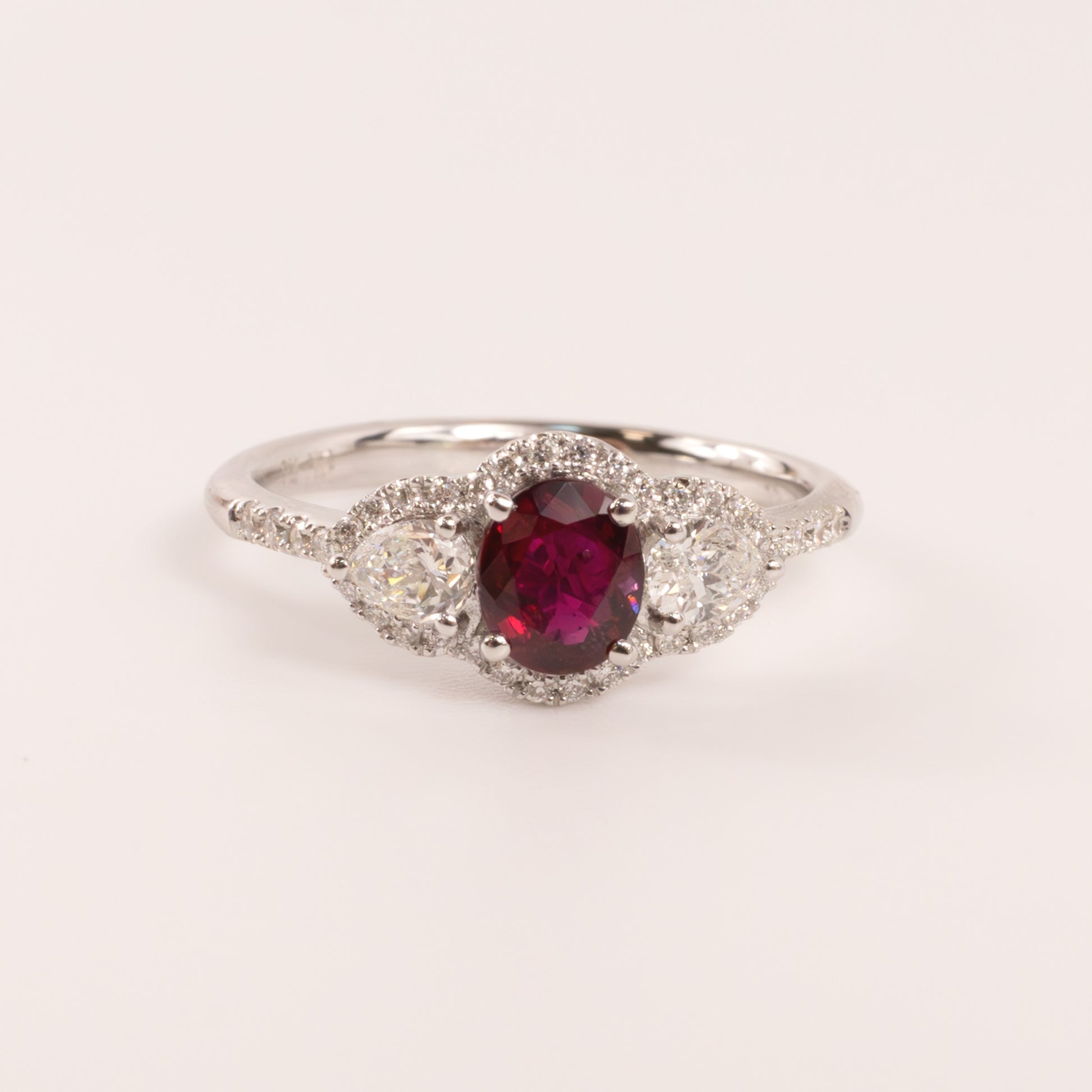 14KWG Ruby Oval with Diamond Pears and Halo Ring