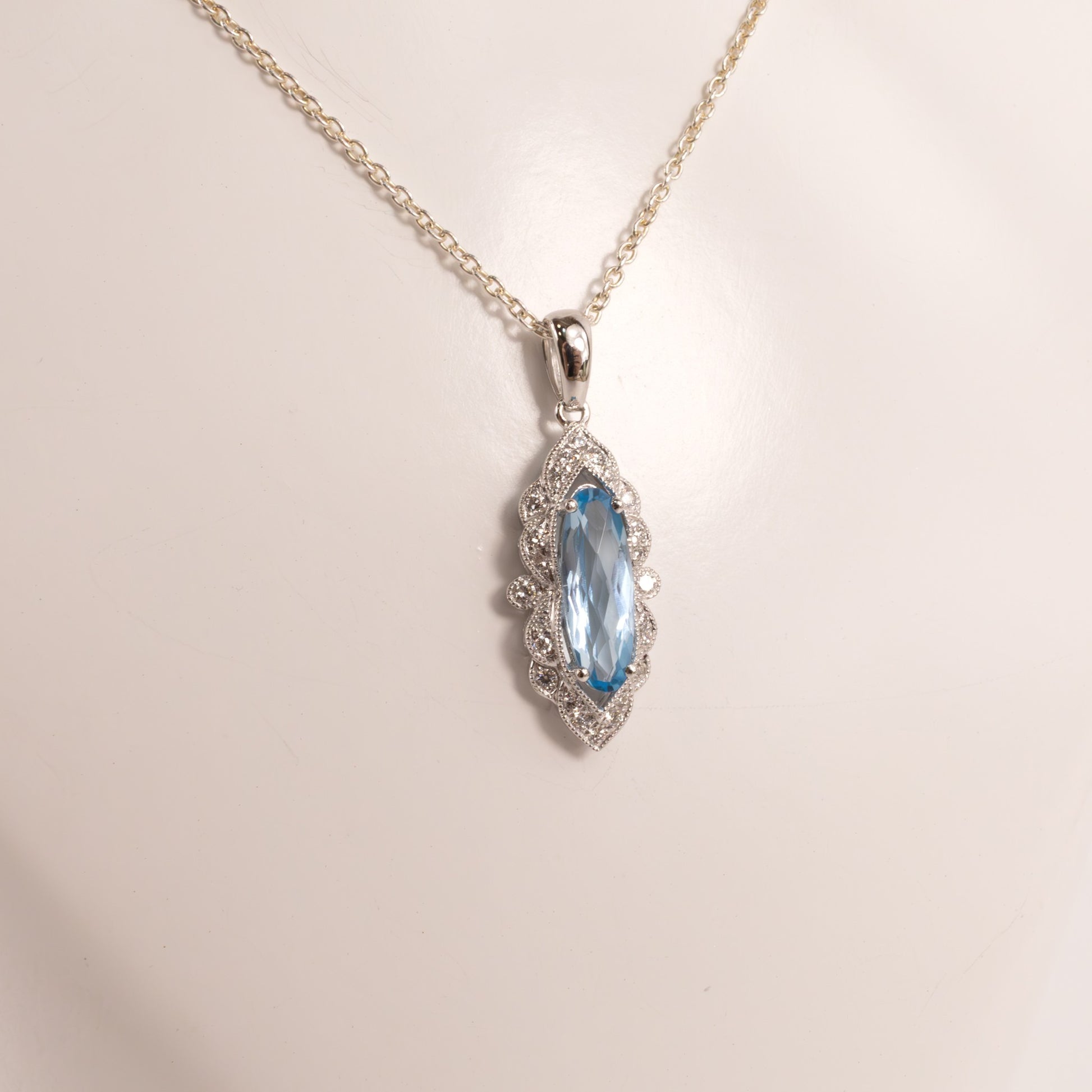 14KWG Blue Topaz Checkerboard Cut Oval and Diamond Scalloped Pendant