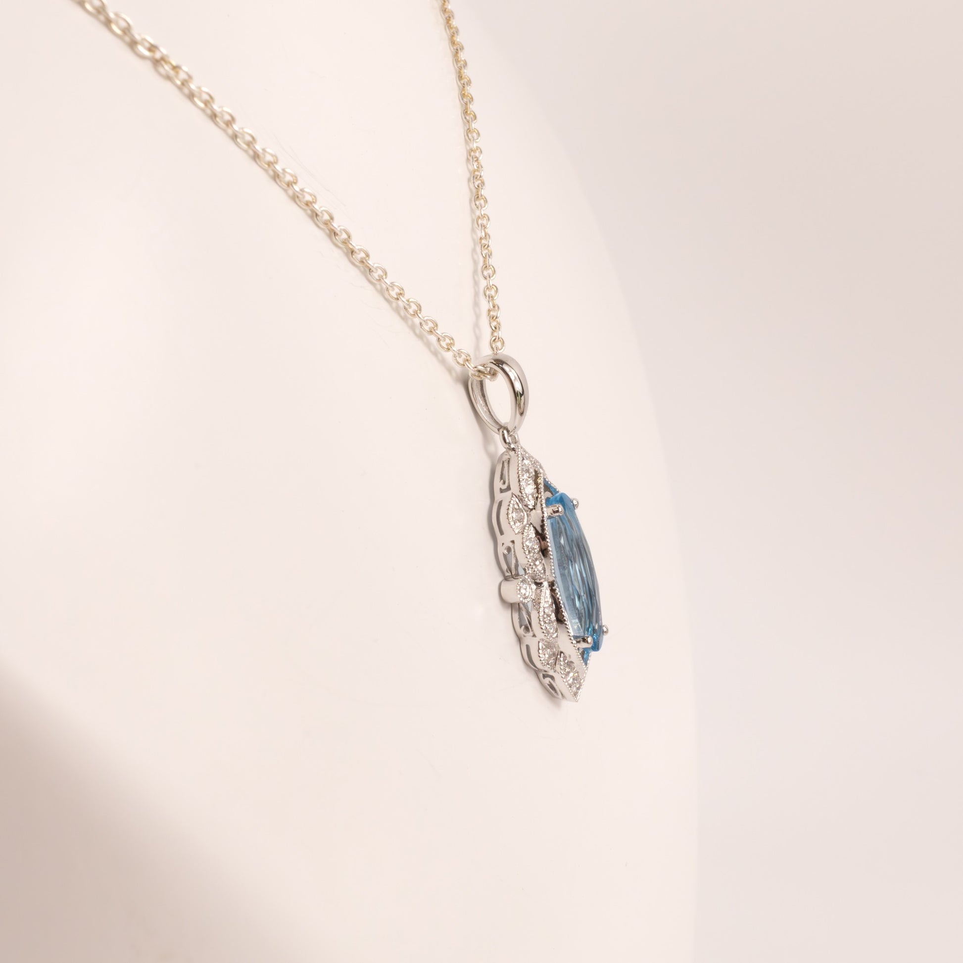 14KWG Blue Topaz Checkerboard Cut Oval and Diamond Scalloped Pendant
