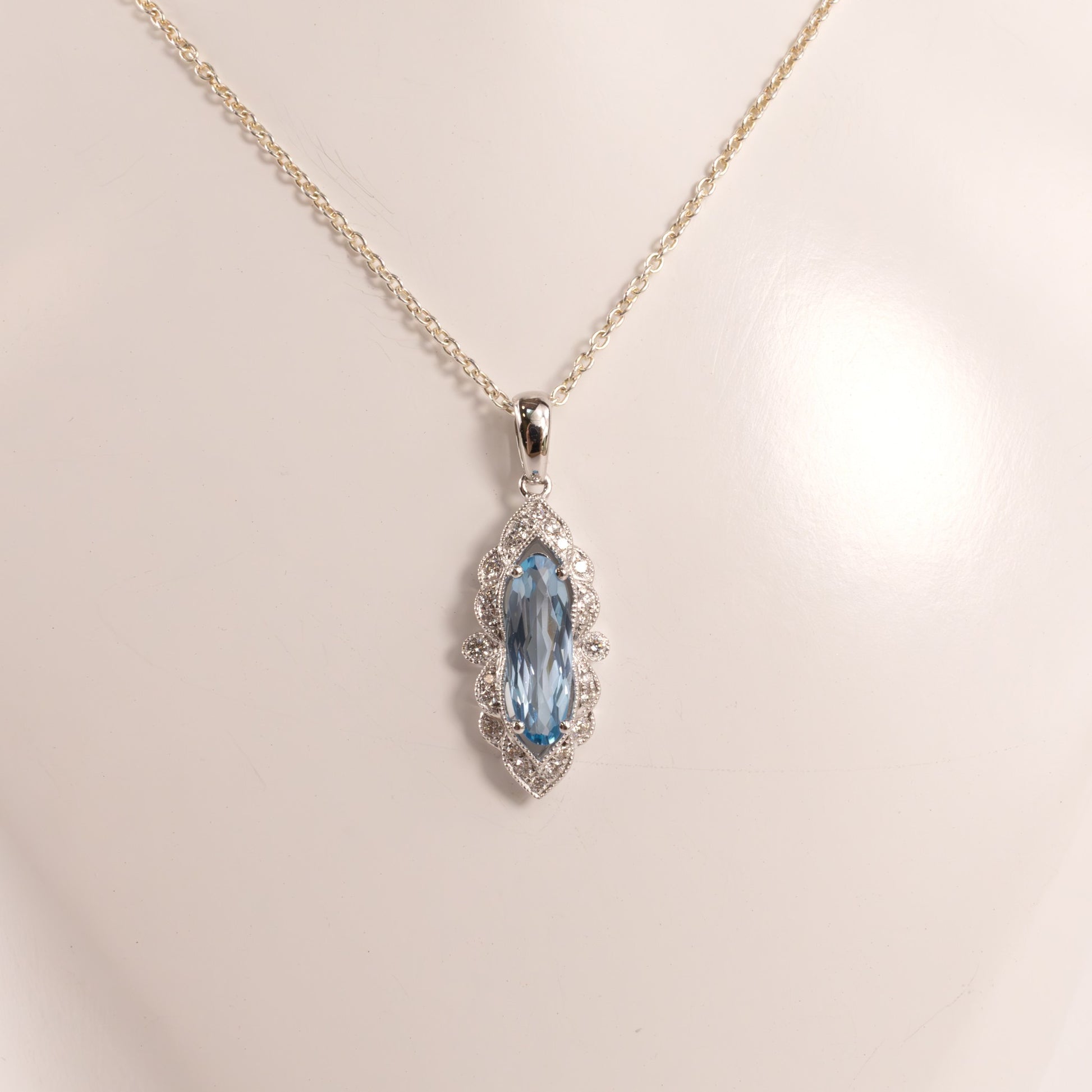 14KWG Blue Topaz Checkerboard Cut Oval and Diamond Scalloped Pendant