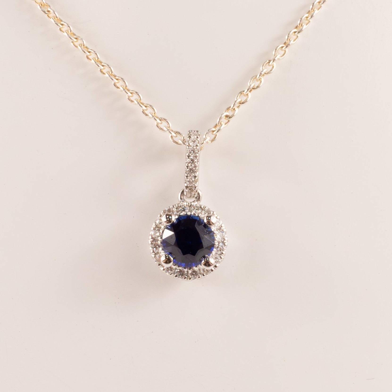 14KWG Blue Sapphire 0.53ct and Diamond 0.09cttw Halo Pendant