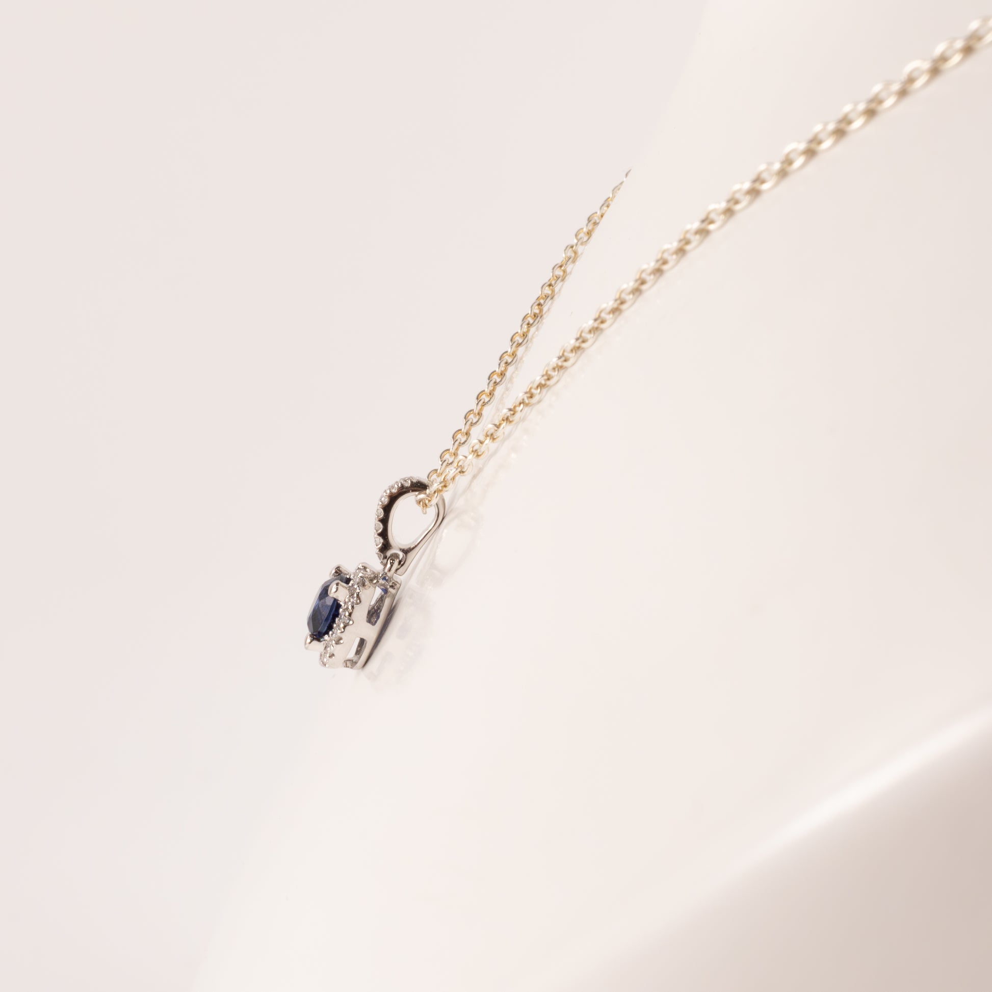 14KWG Blue Sapphire 0.53ct and Diamond 0.09cttw Halo Pendant